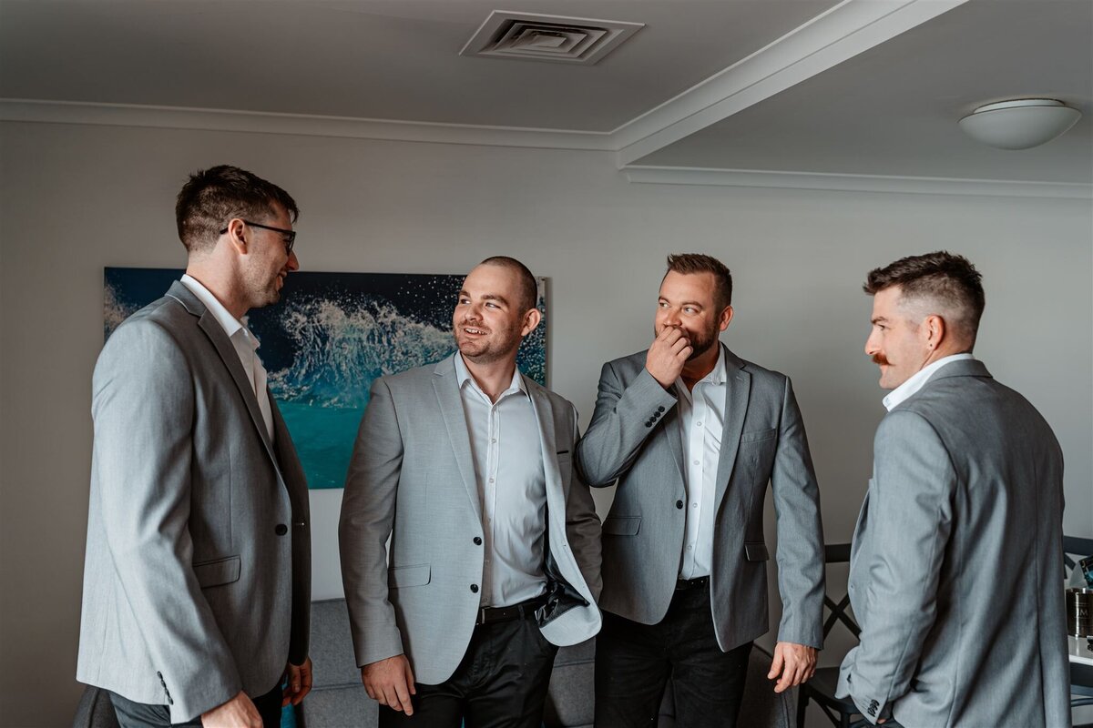 Cory and his groomsmen looking into each other! Having their beautiful suit