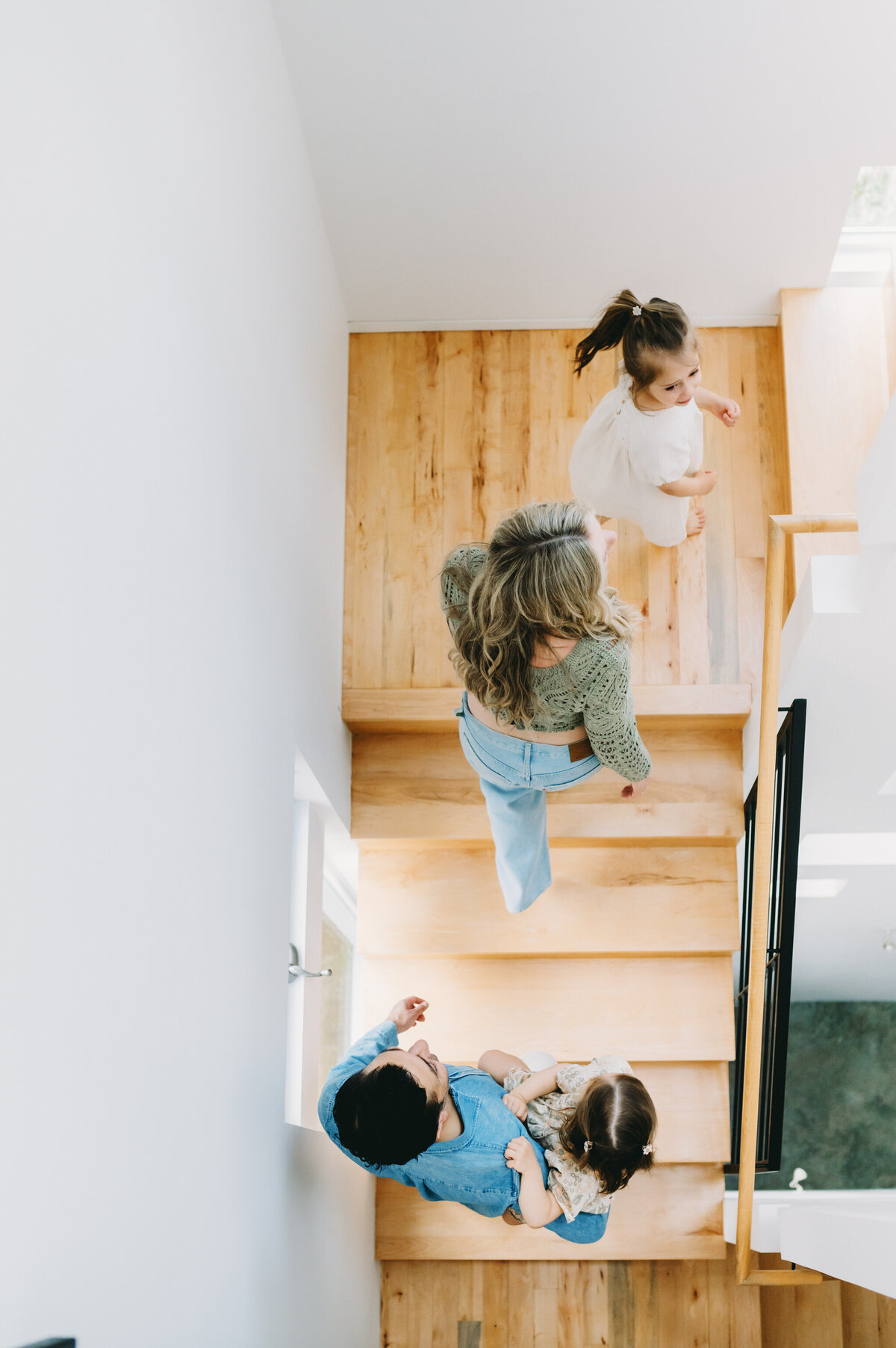 family walking up stairs