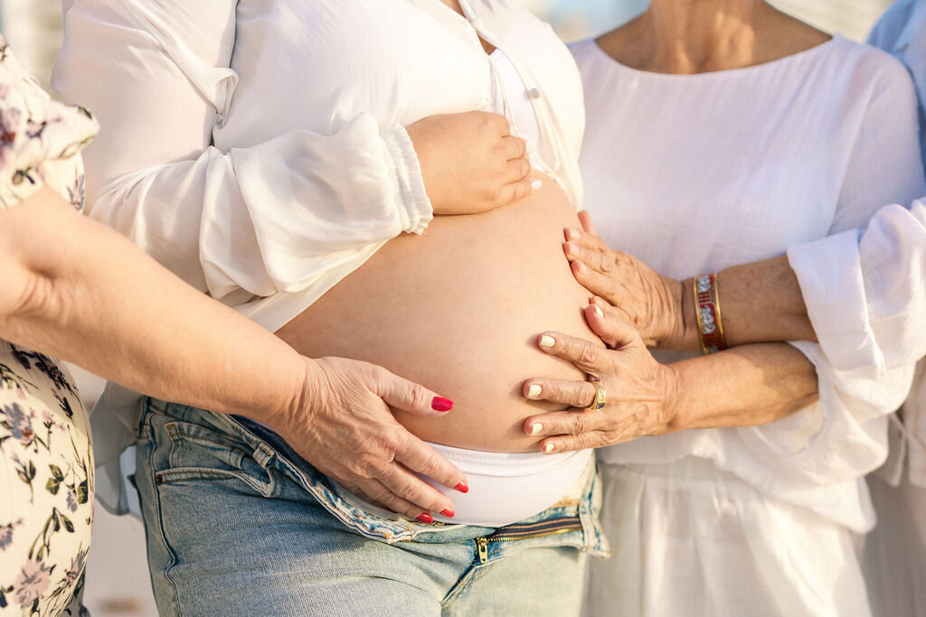 miami-maternity-multigenerational-hands-belly