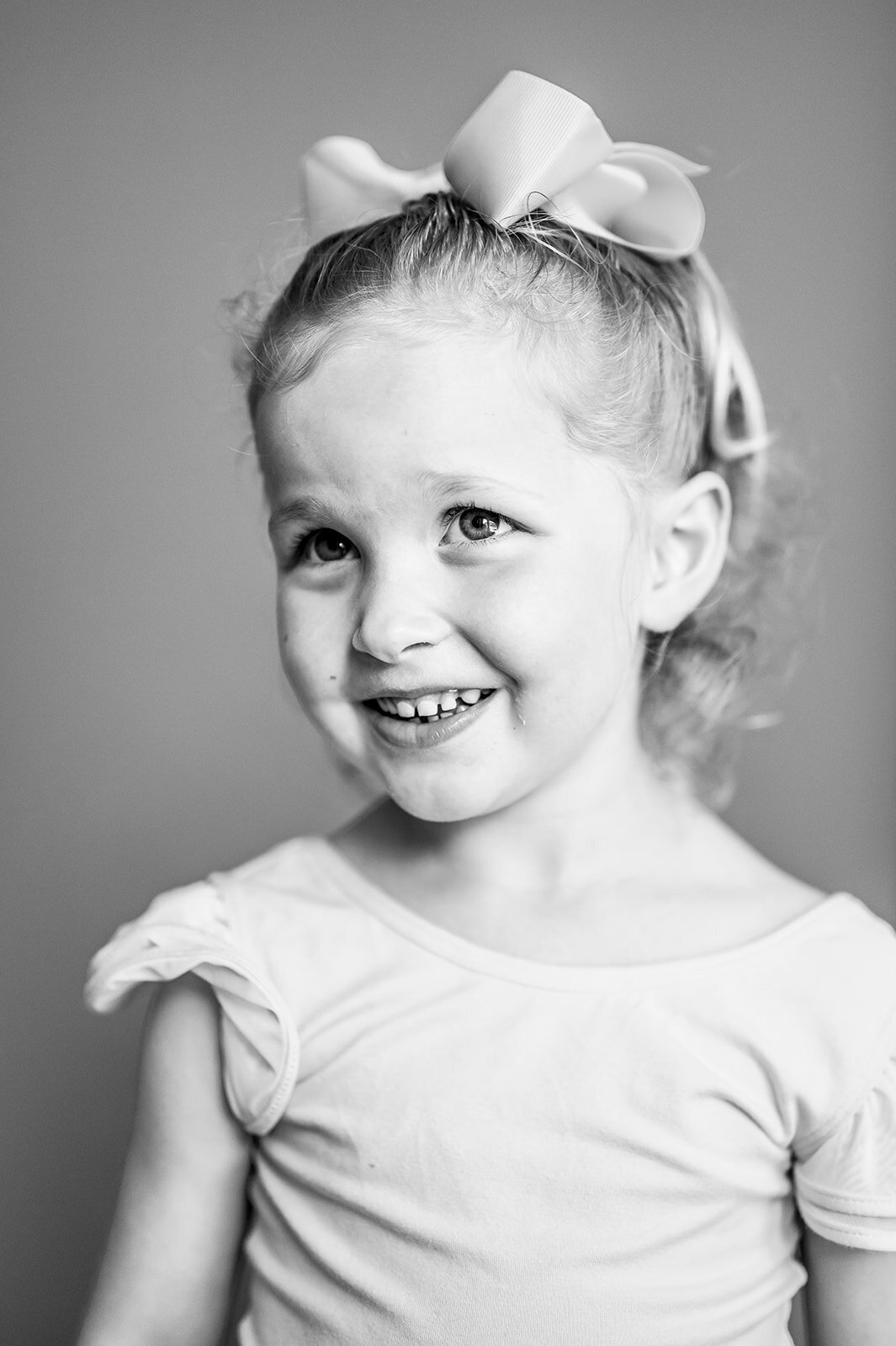 Modern school photography session with a girl wearing a bow, Connecticut location