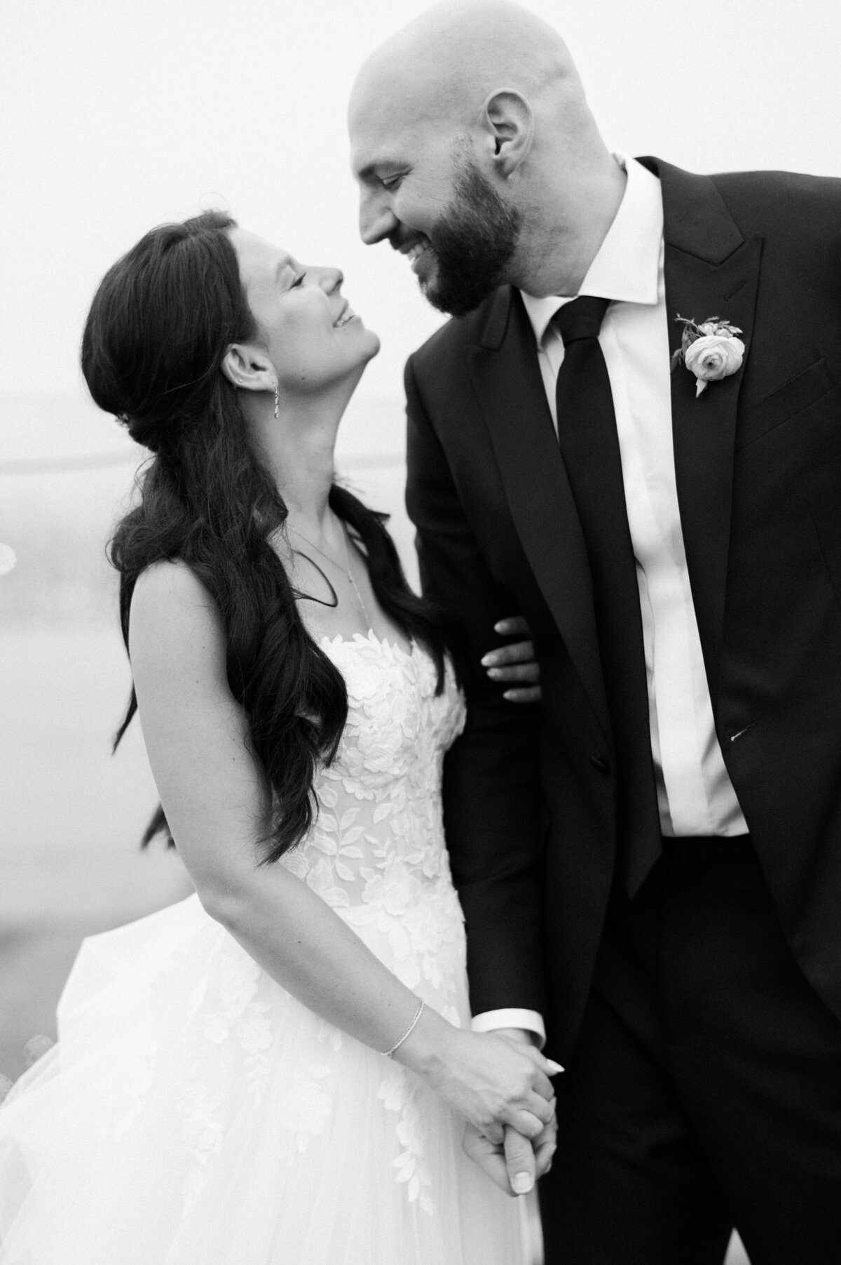 Newlyweds look at each other and smile
