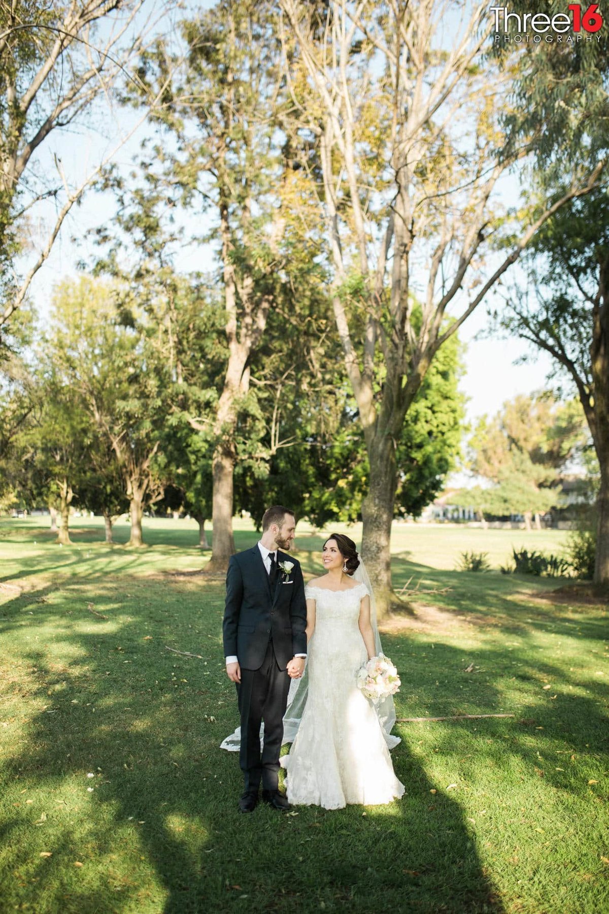 Bride and Groom pose for the wedding photographer