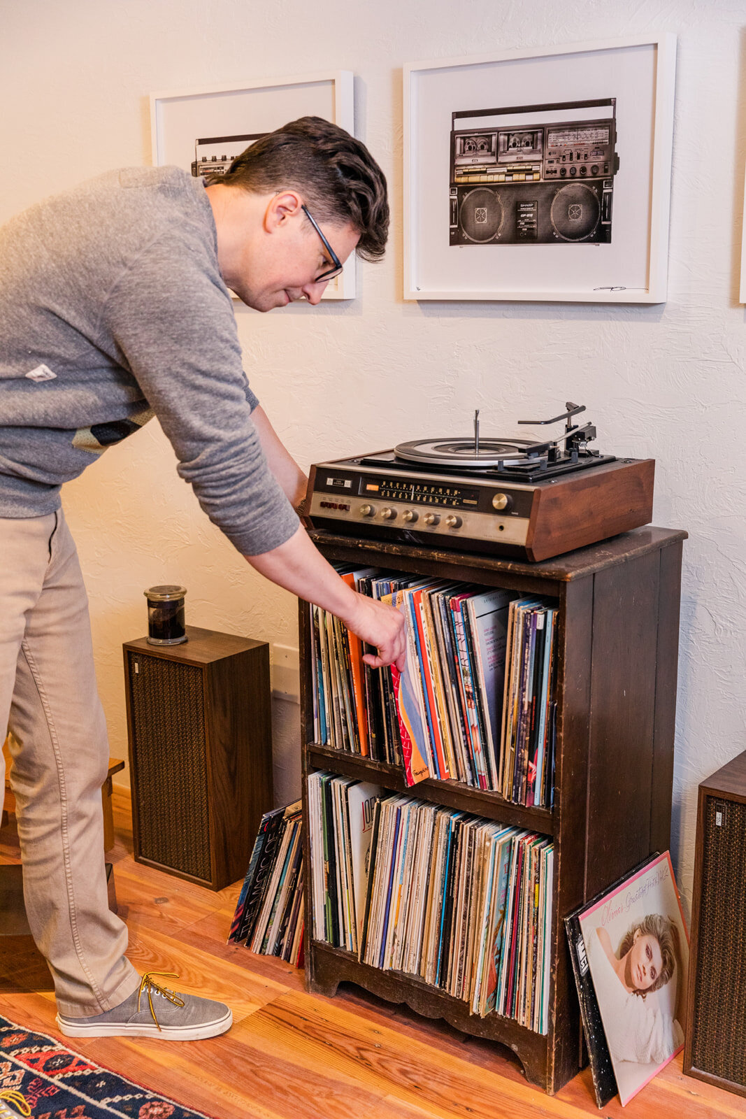 man selecting a 33 RPM vinyls records