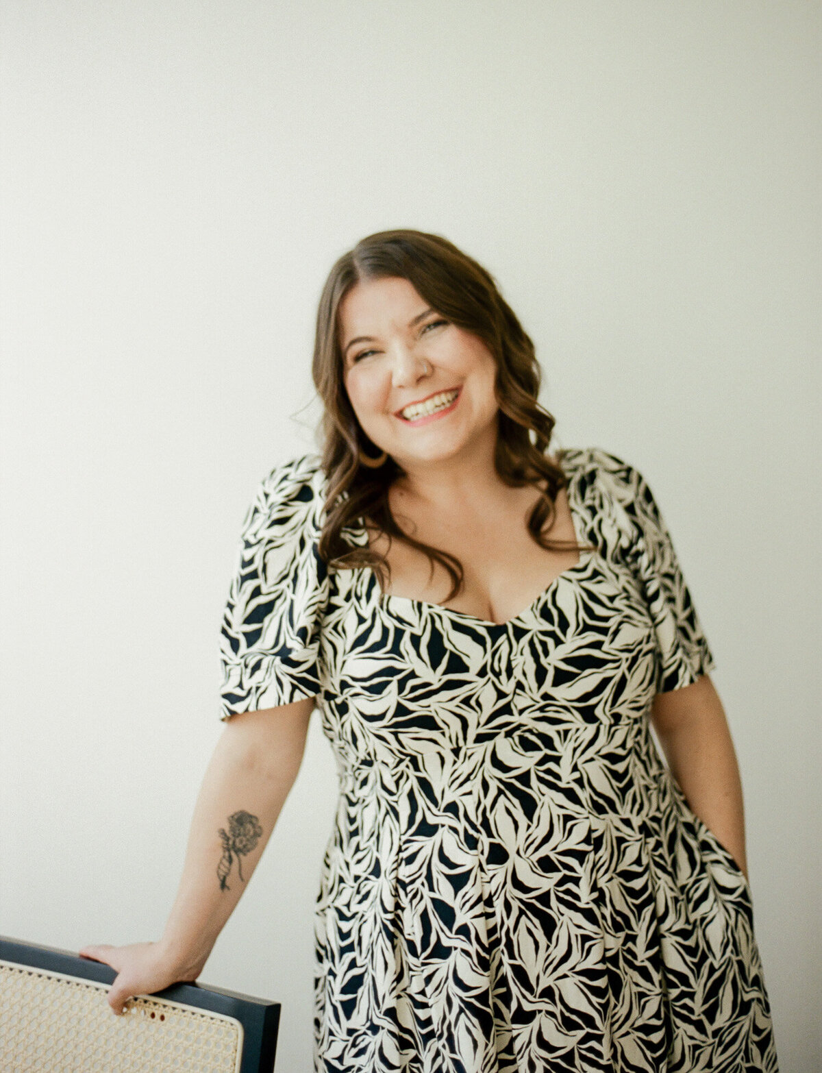 brunette woman in patterned black and white dress headshot, film branding headshots