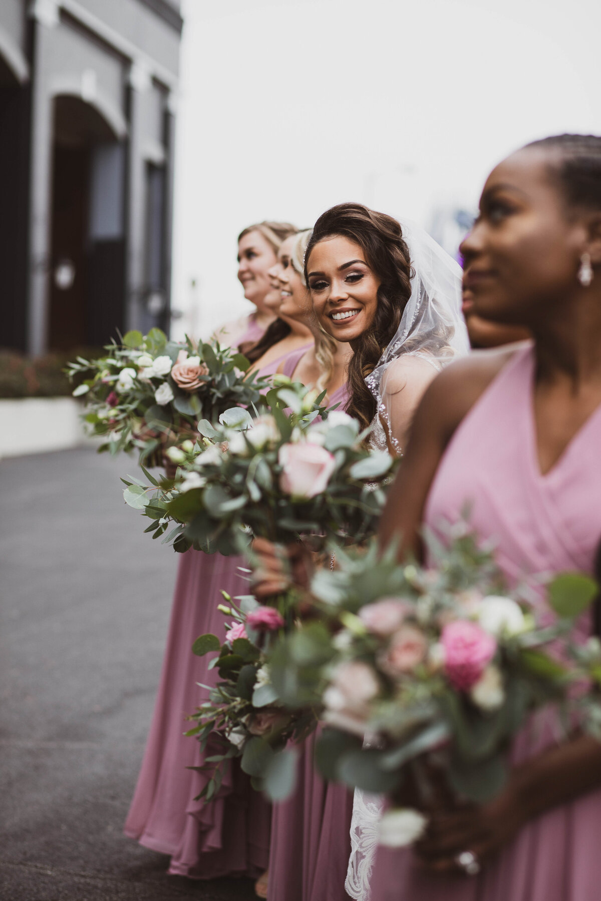 Bride-smiling-with-bridal-party