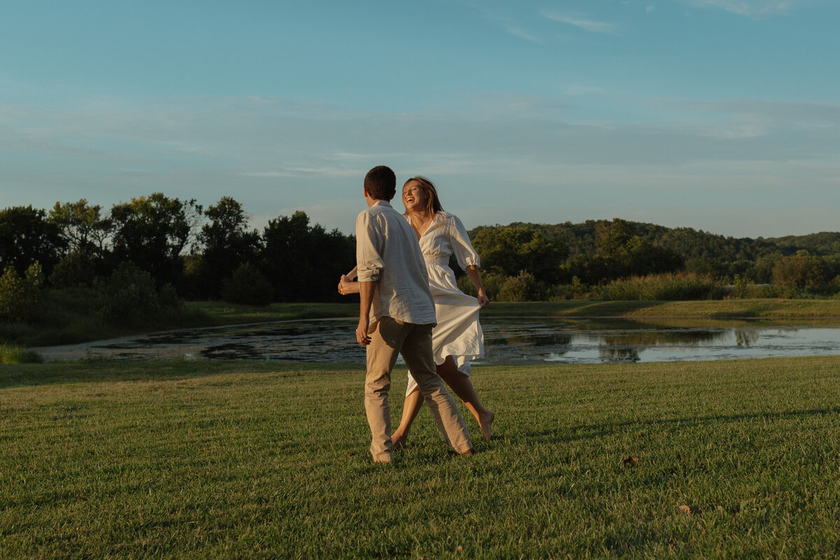 Sunlit picnic moment during a couples session in a vibrant tropical winery setting

