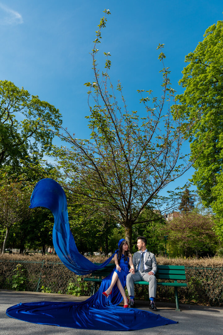 Paris bench couple portrait, royal blue flying dress movement, romantic photography