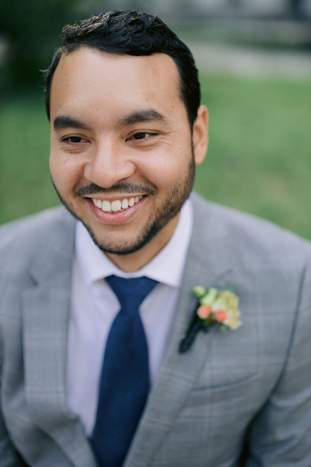 The groom is so happy at a park in New York. Image by Jenny Fu Studio