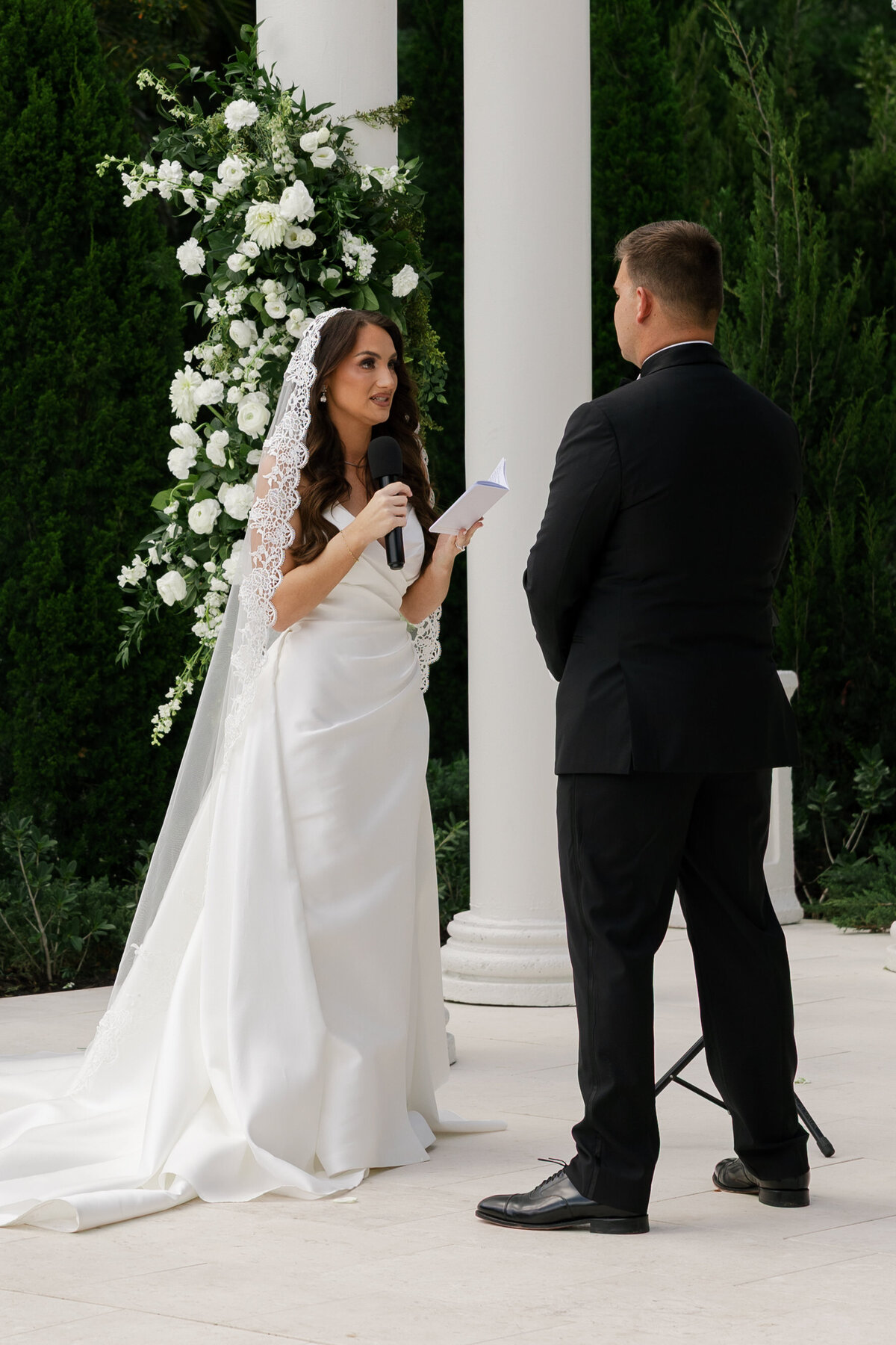Bride reading her ceremony vows at La Casa Toscana
