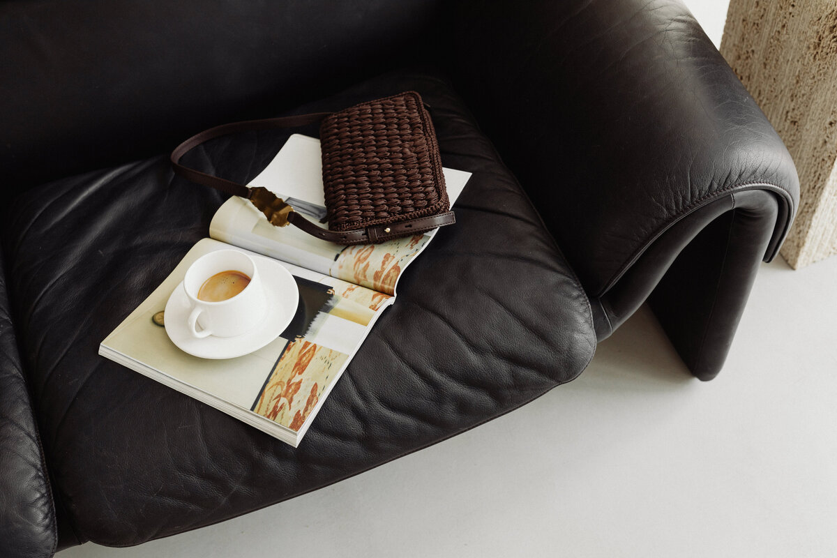 kaboompics_de-sede-ds-2011-black-leather-two-leather-sofa-cup-of-coffee-35859