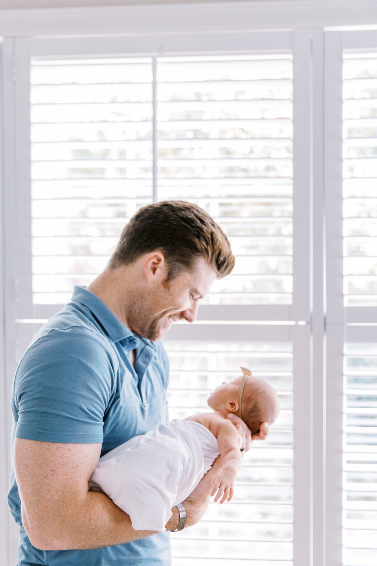 Dad with newborn in Raleigh by Raleigh Newborn Photographer
