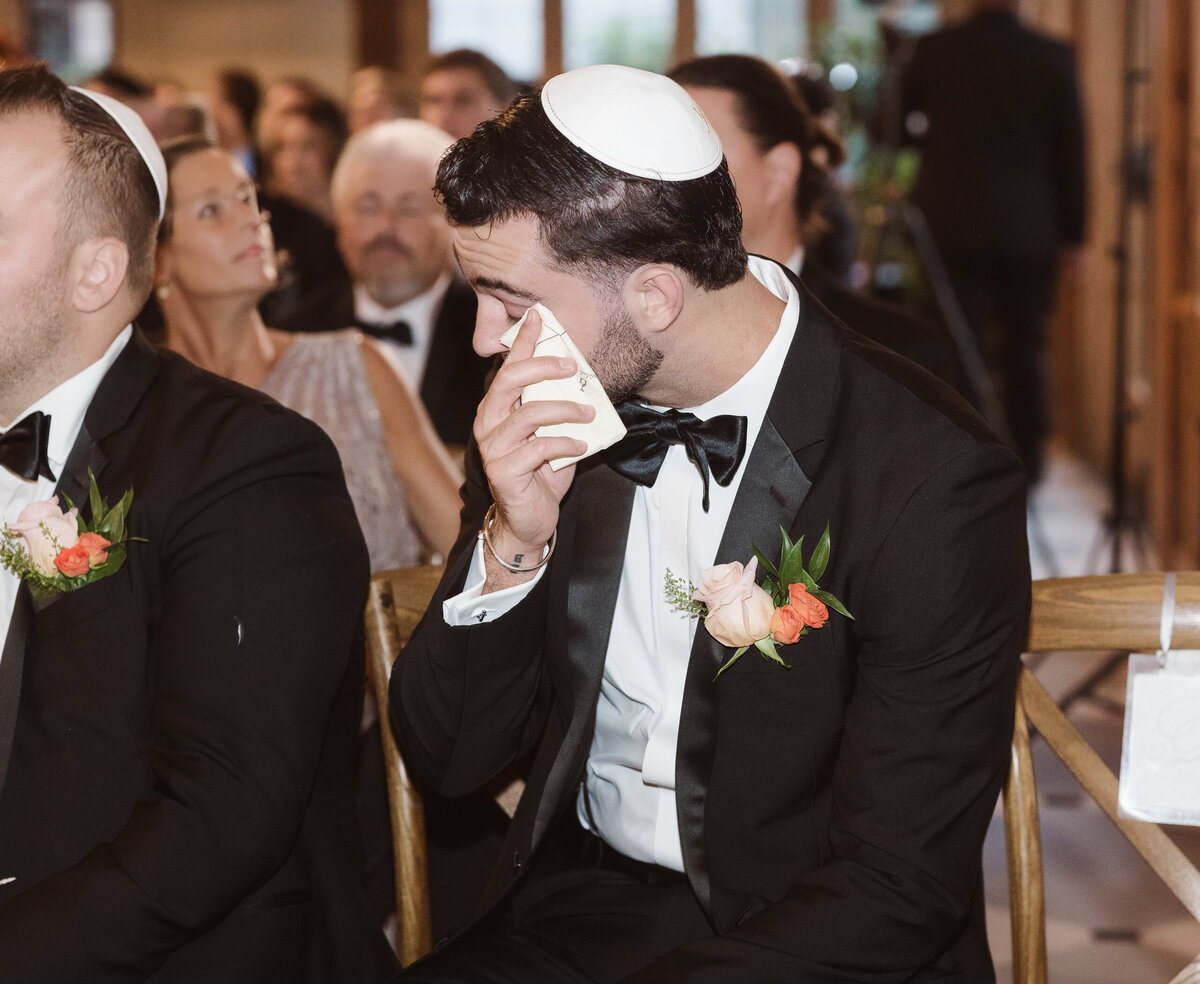 crying guest candid at ceremony