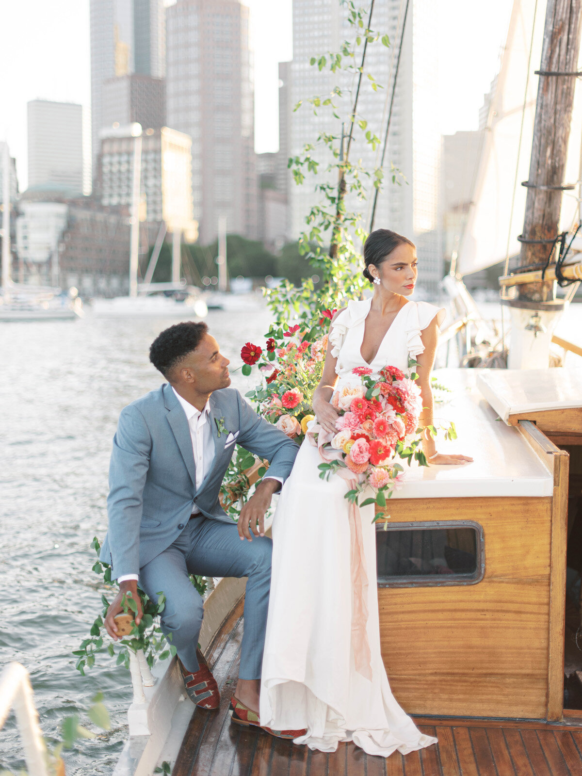 Kate-Murtaugh-Events-elopement-wedding-planner-Boston-Harbor-sailing-sail-boat-yacht-greenery-water-skyline-couple-bouquet-schooner