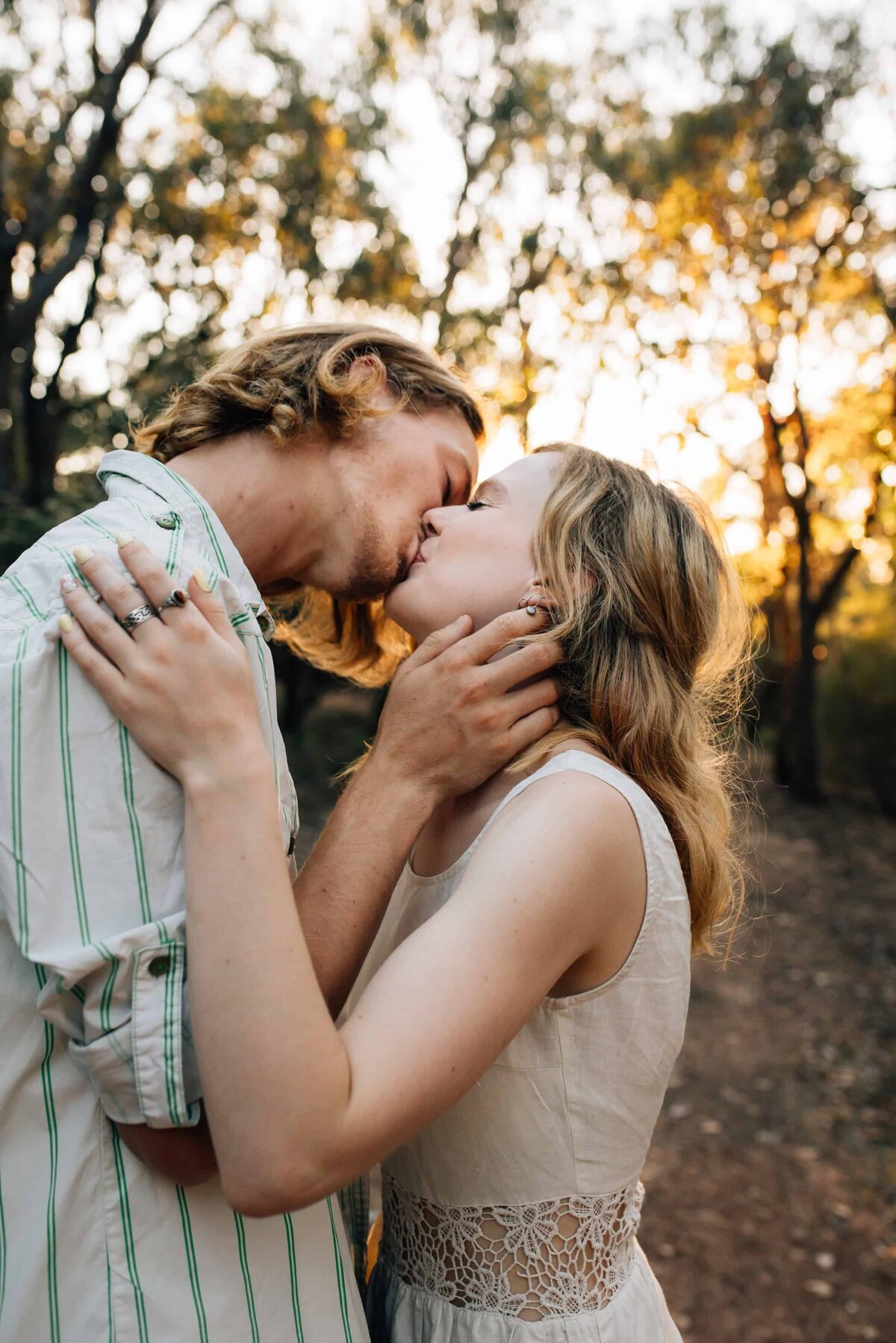 Young couple kissing in bushland, during couples photoshoot Melbourne, And So I Don't Forget Photography