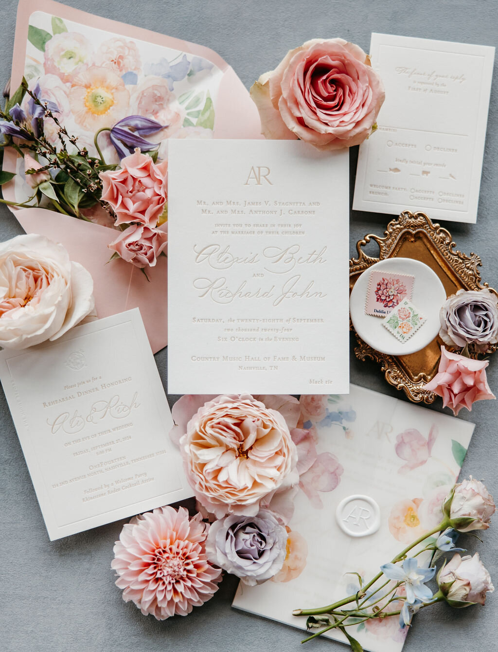 pastel floral wedding invitation with vellum wrap and wax seal