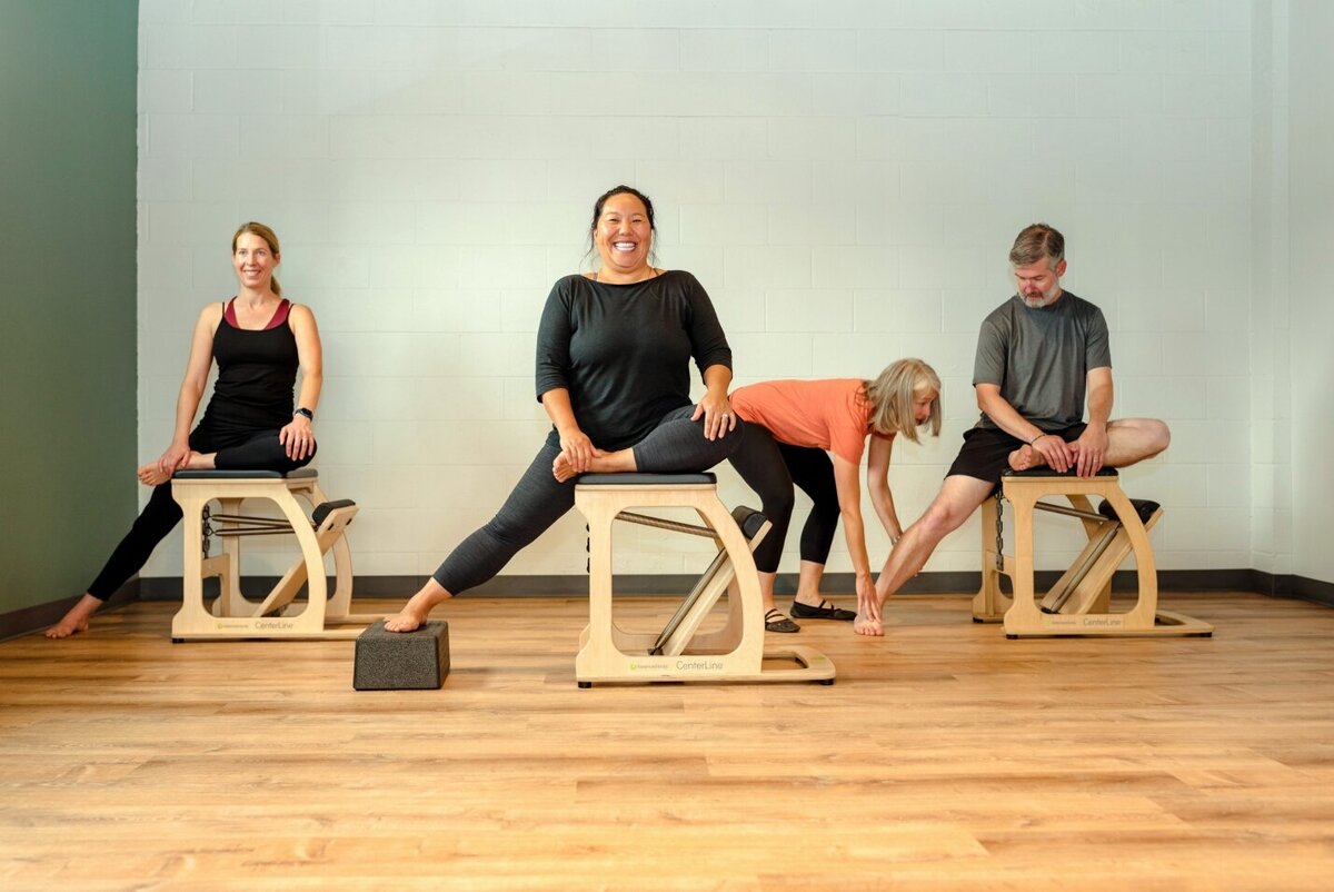 classical-pilates-chair-class-students-smiling