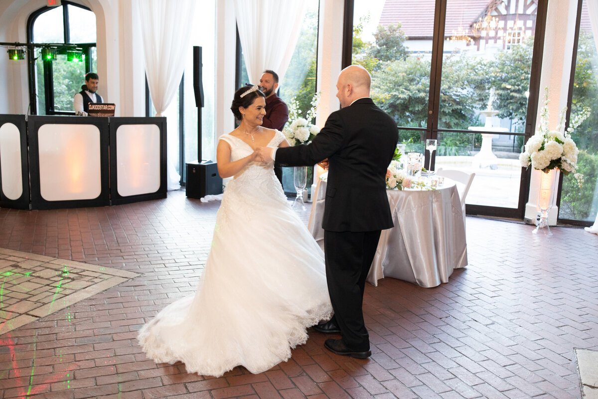 quiet-luxury-wedding-first-dance-indoor-reception-atlanta-bride-groom-smiling