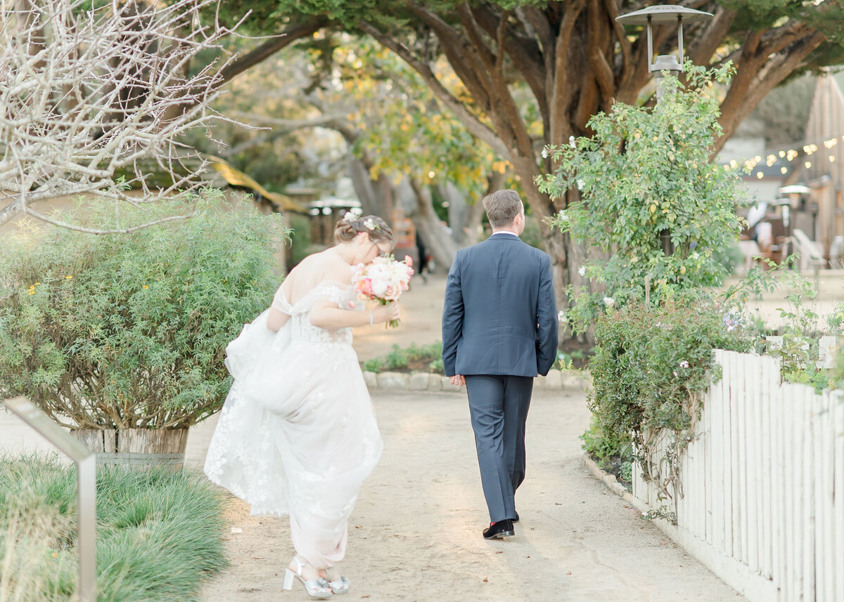 bride and groom walking away from camera 