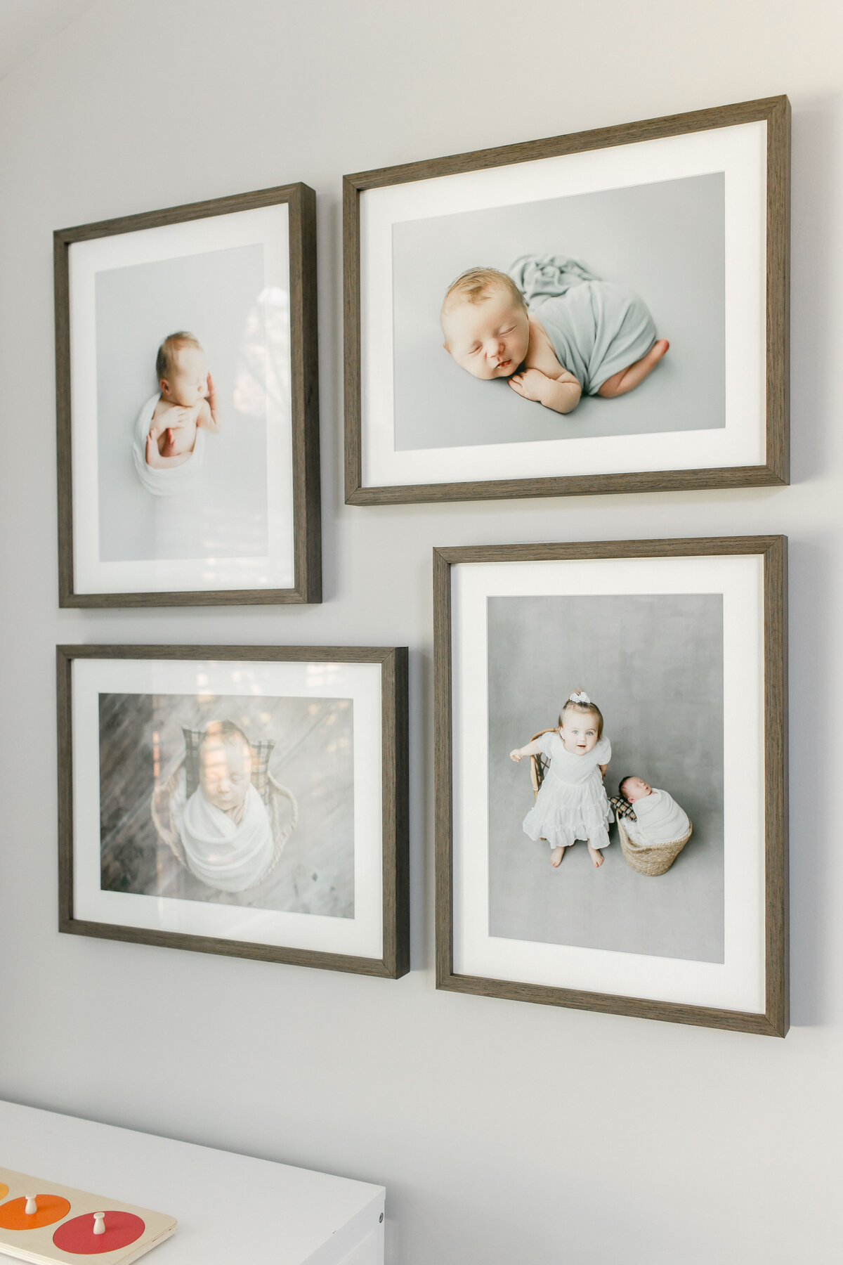 newborn photo frames on wall by nj portrait photographer