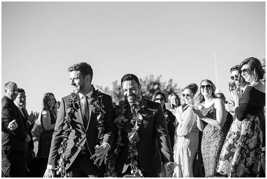 Grooms Walking Up the Aisle After Wedding © Bonnie Sen Photography