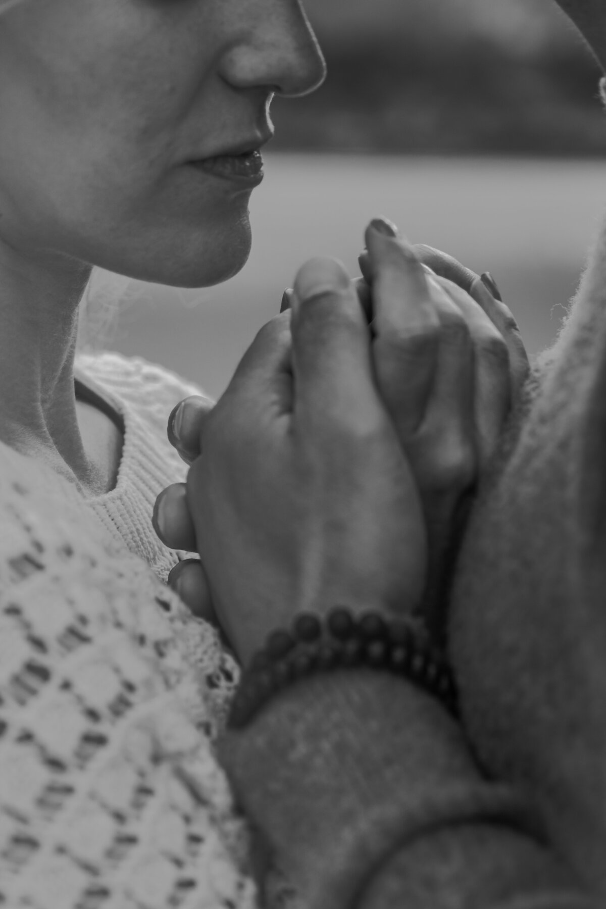 Close-up of hands intertwined