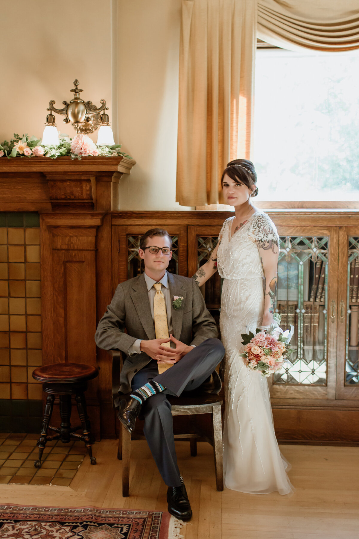A beautiful indoor portrait of a couple in wedding attire captured by Fort Worth Wedding Photographer, Megan Christine Studio