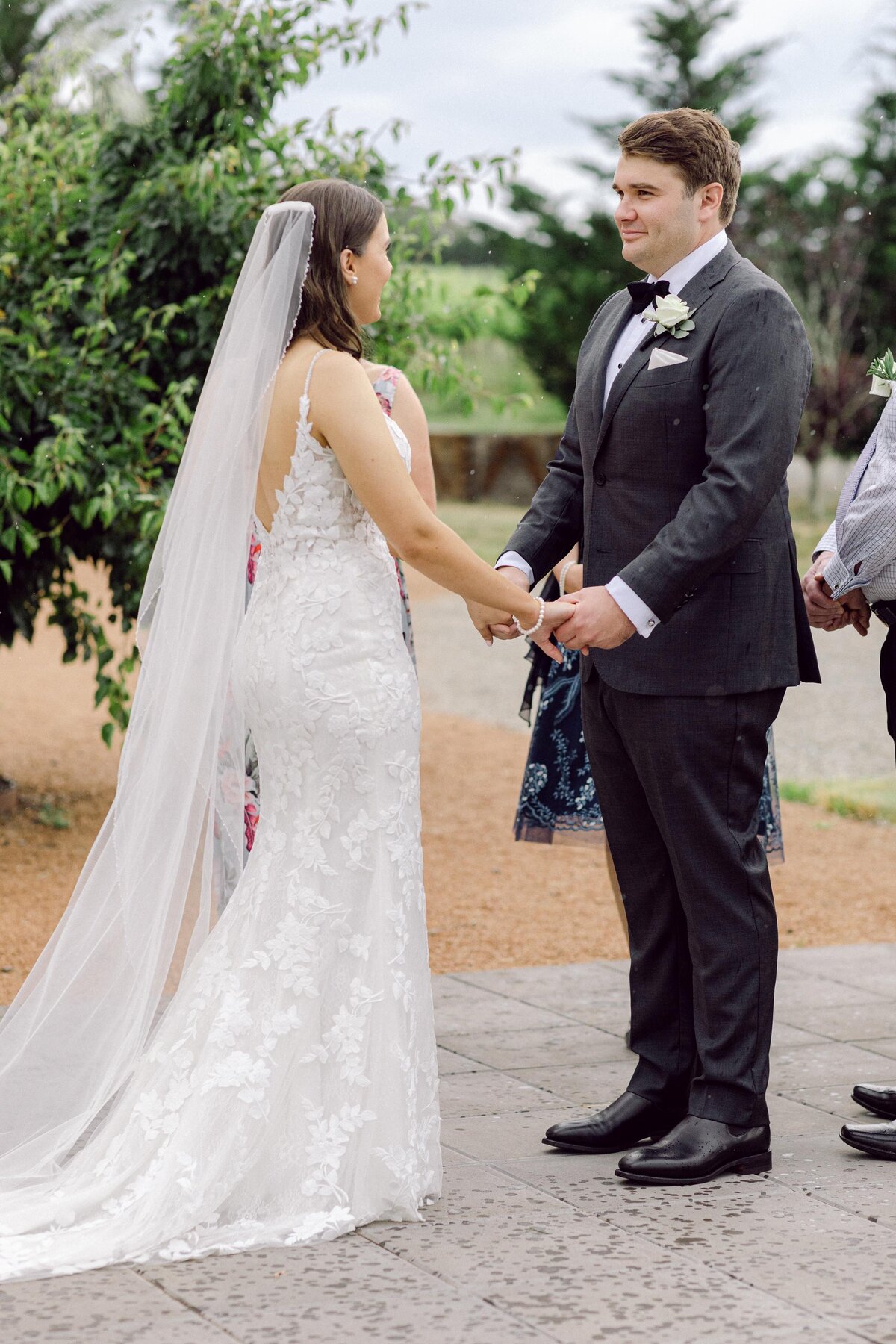 bride and groom holding hands