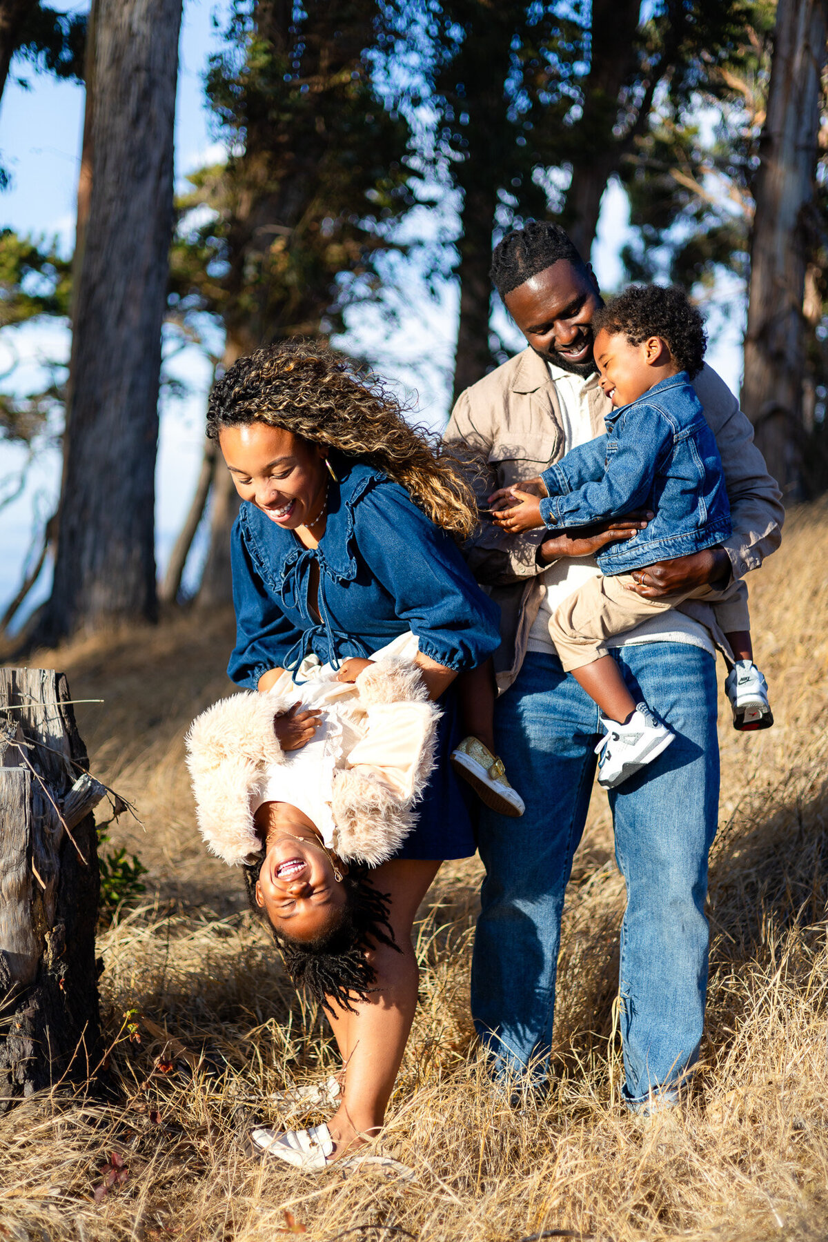 Parents laughing with children during playful outdoor family session, Bay Area Family Portfolio – Ellobelle Photography