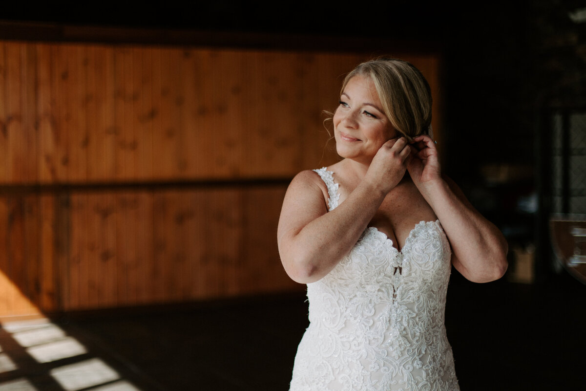 bride putting in an earring