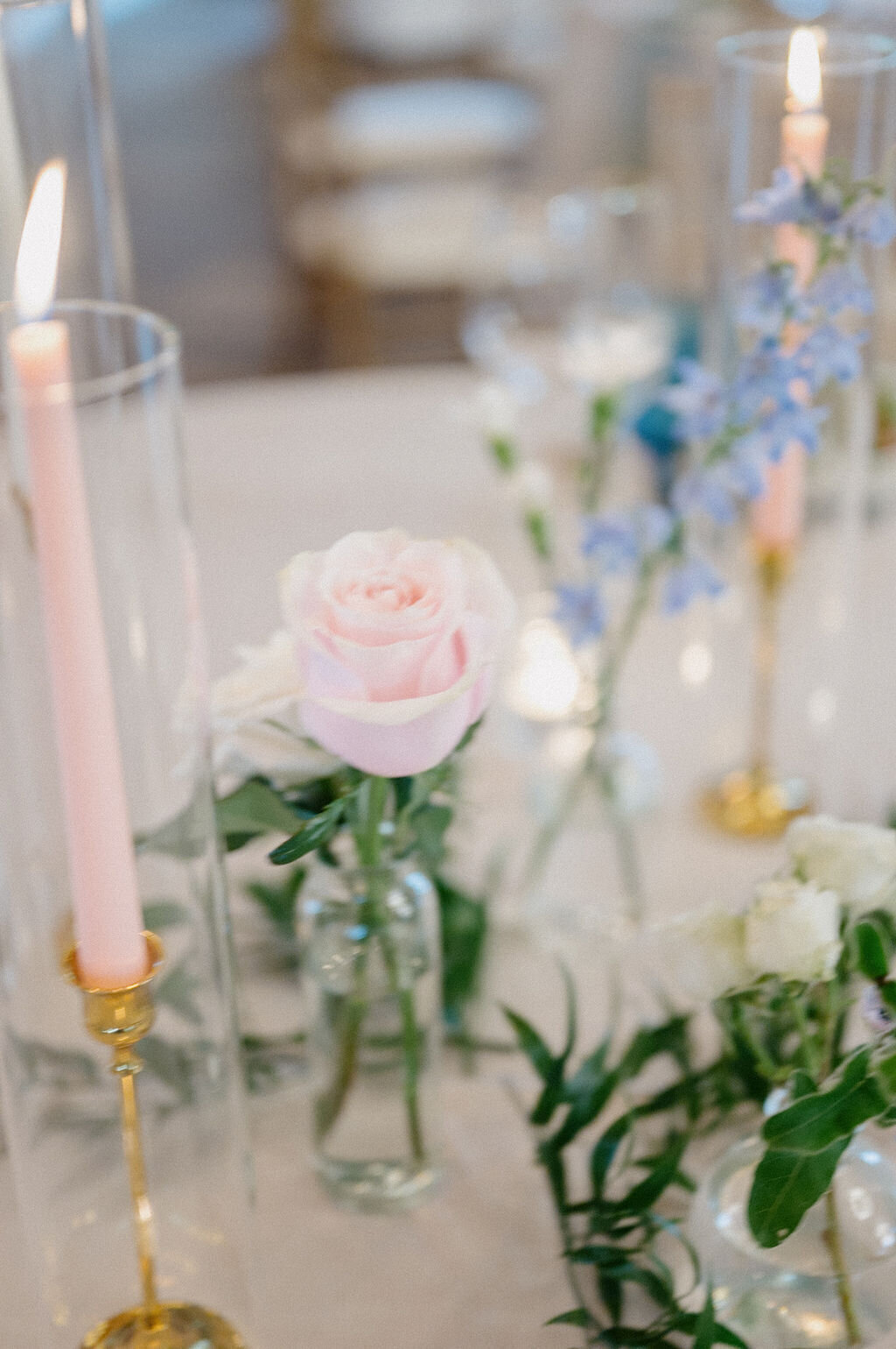 Pink floral and candle in glass