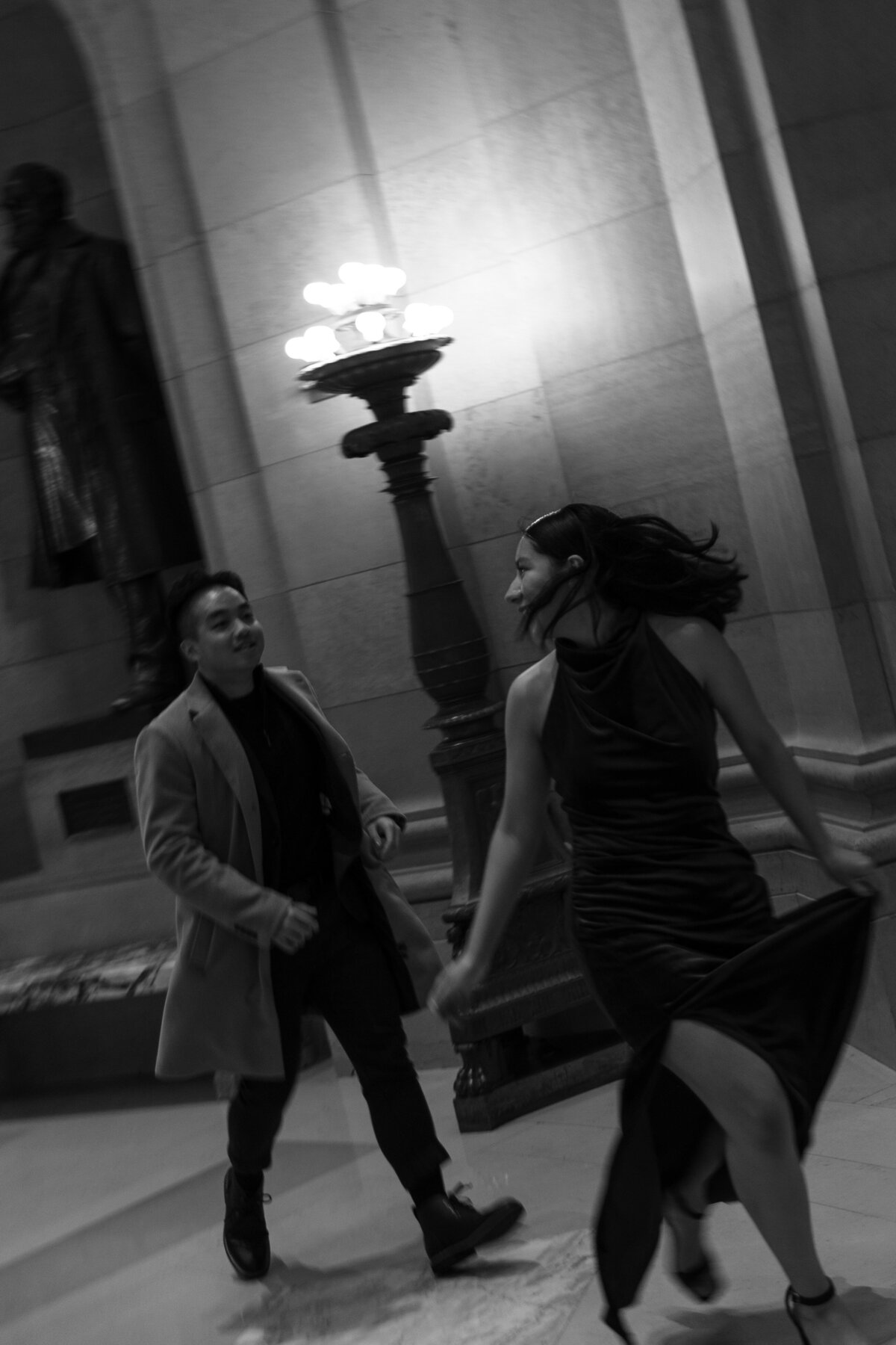 Couple Running Through the Mn State Capitol Building in Black and White 