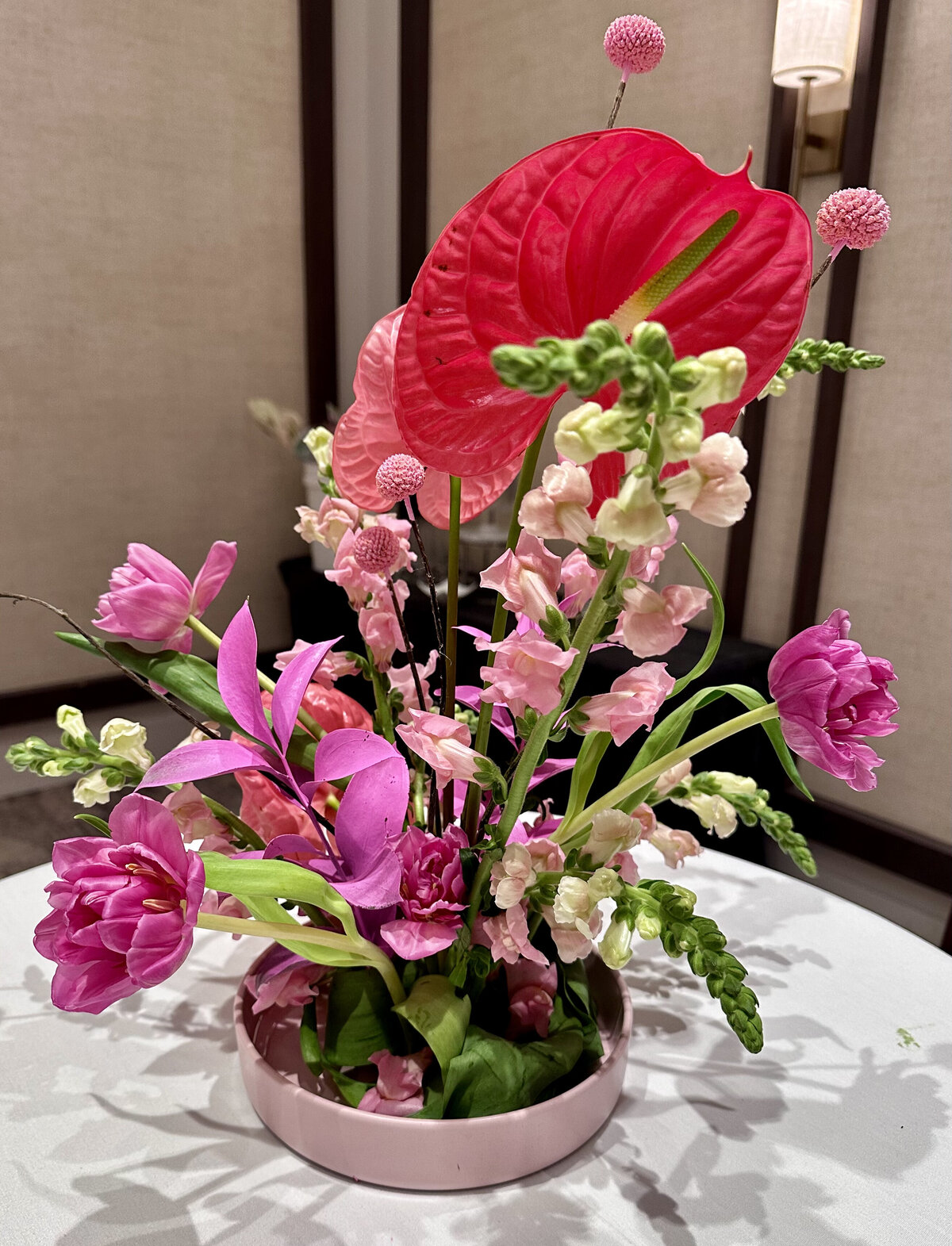 Bold and colorful floral centerpiece featuring vibrant blooms, elegantly arranged to create a stunning focal point, designed by In Full Bloom Event Planning & Design