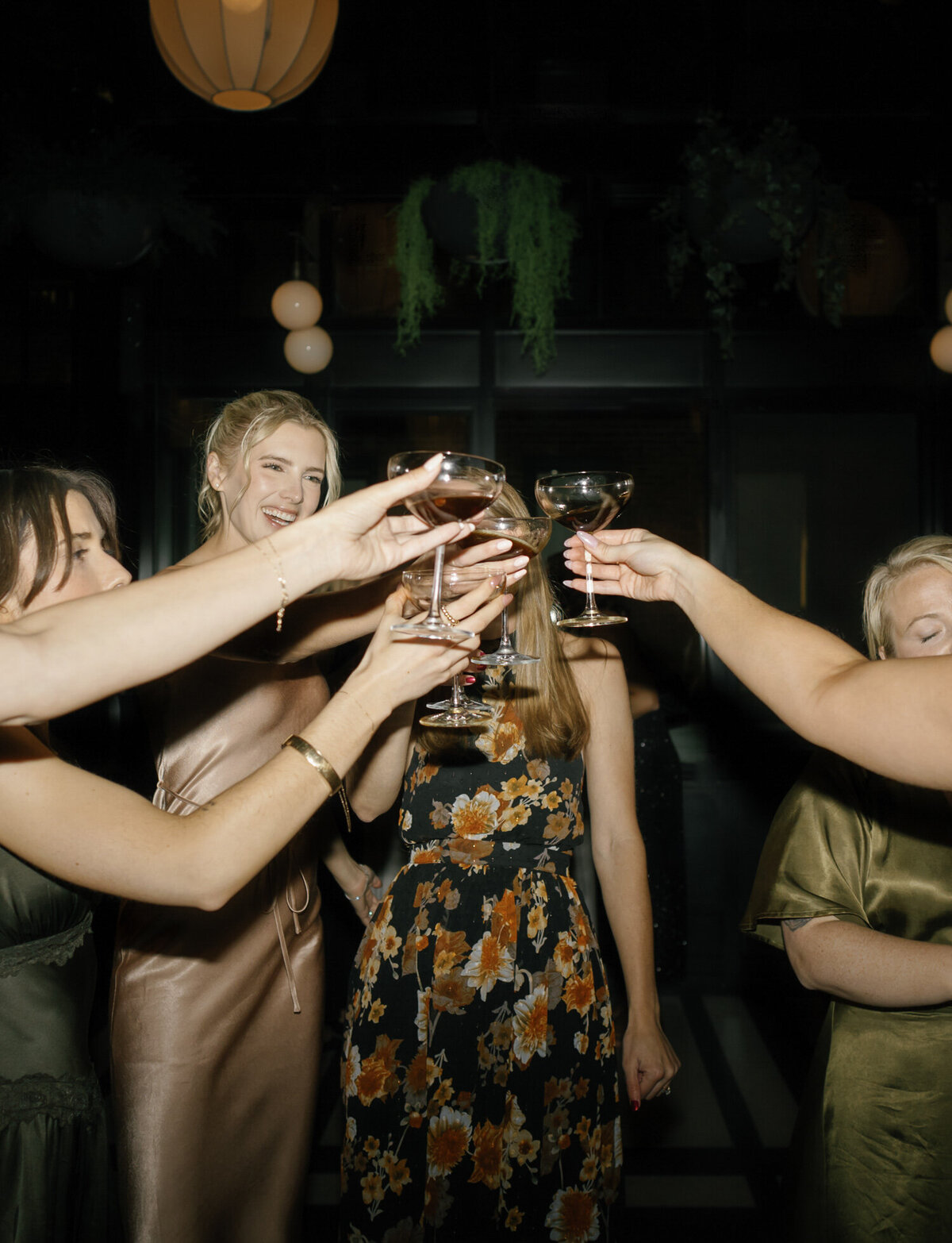 bridesmaids toast with espresso martinis on the dance floor at a Shinola Hotel wedding