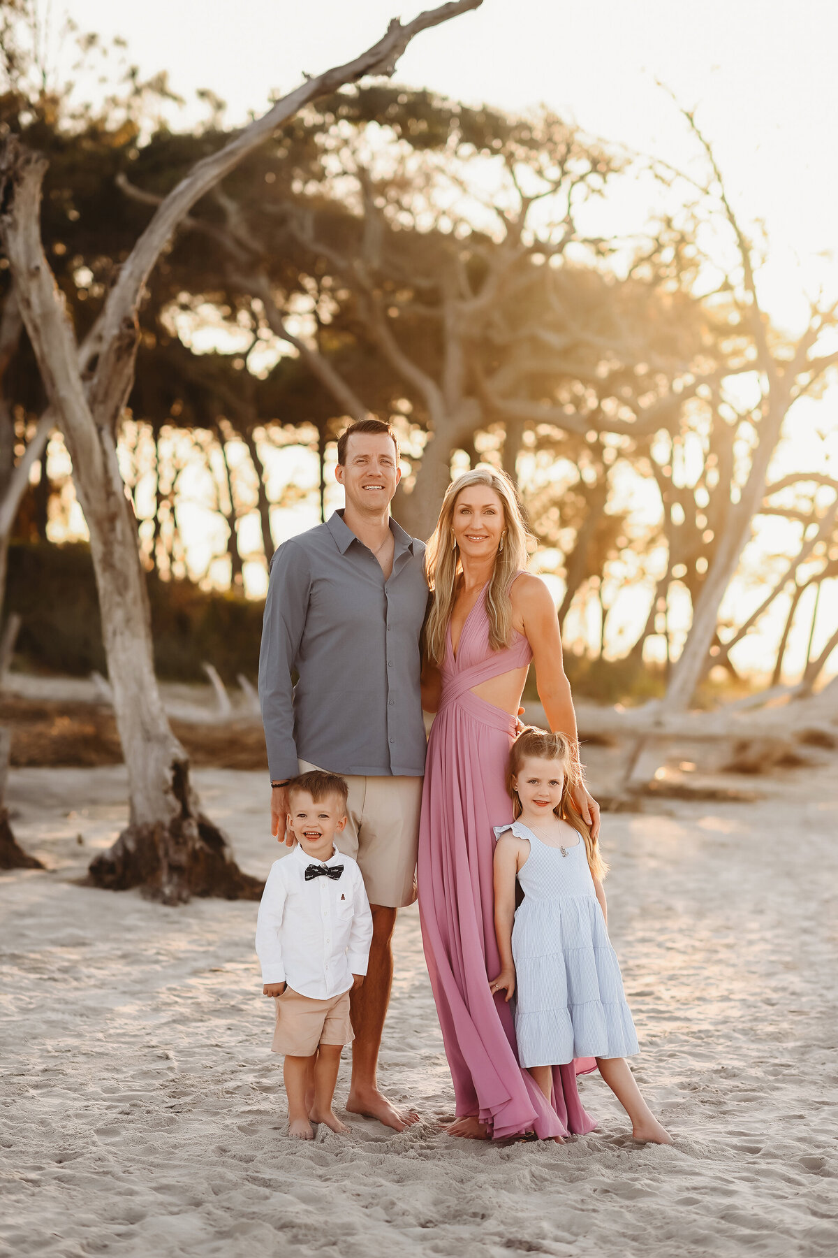 Family poses together during Family Pictures on Folly Beach. 