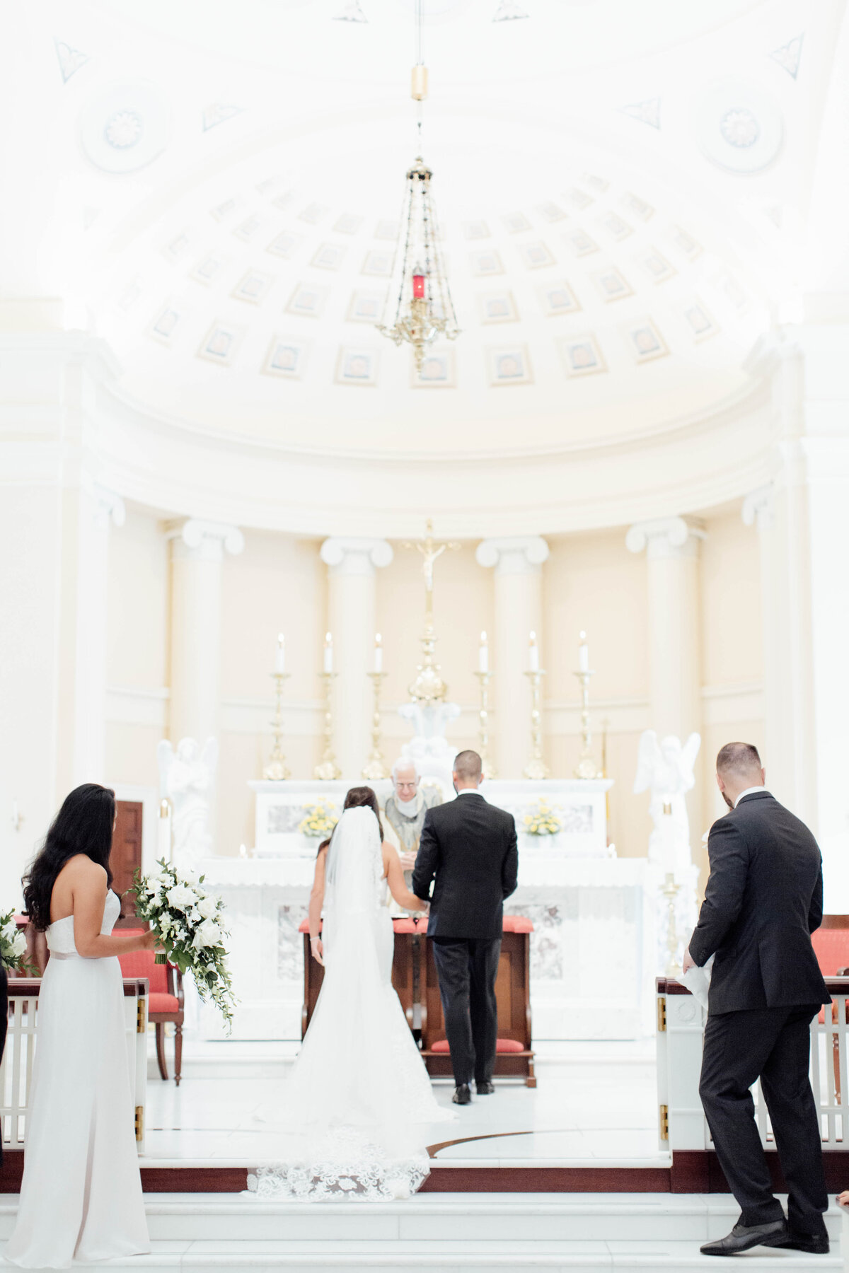 Bride and groom exchanging vows at their wedding.