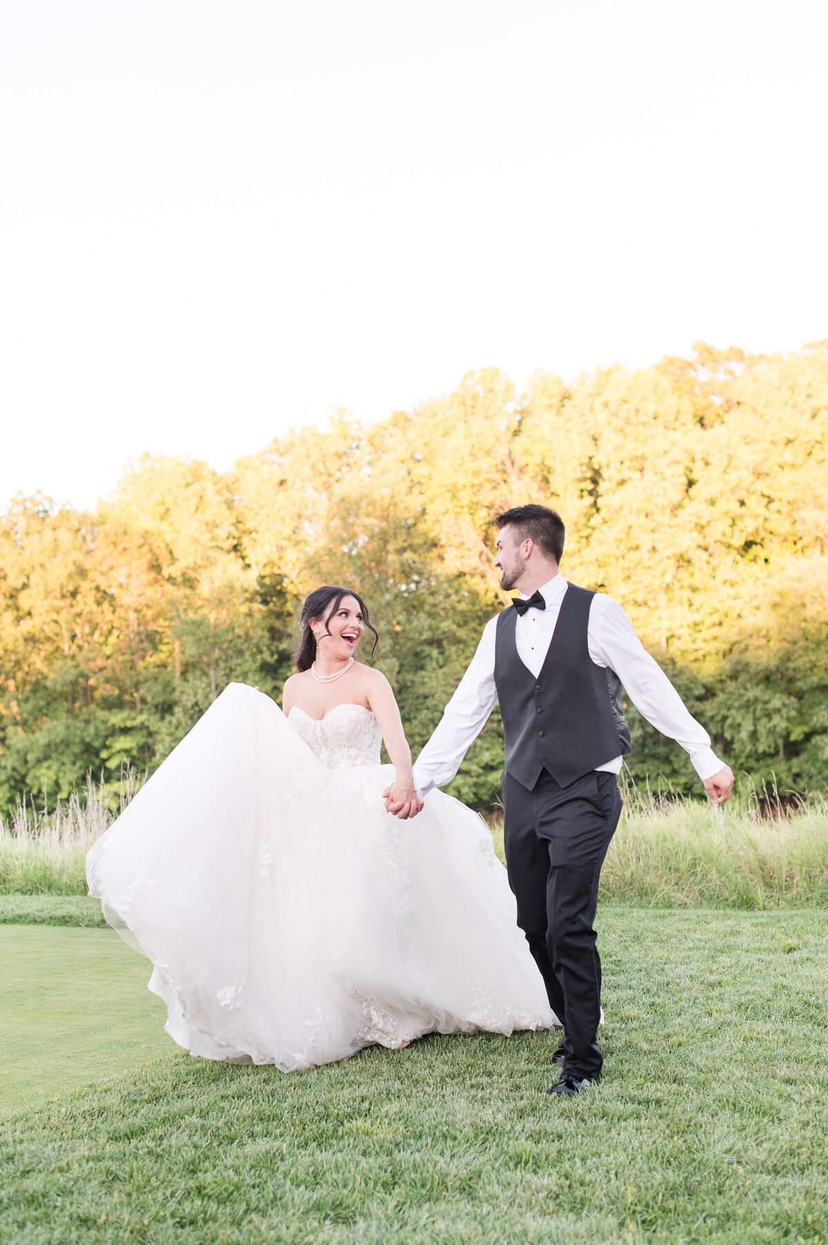 couple frolicking in a field