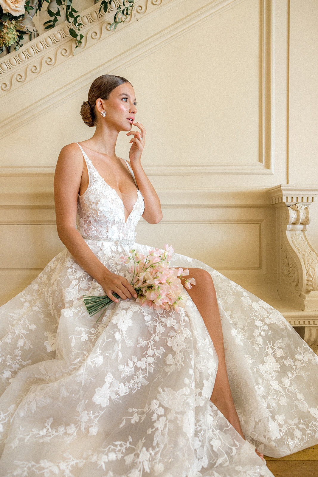 Bride looking to the right in an elegant wedding dress at the Cairnwood  Estate in Philadelphia, PA