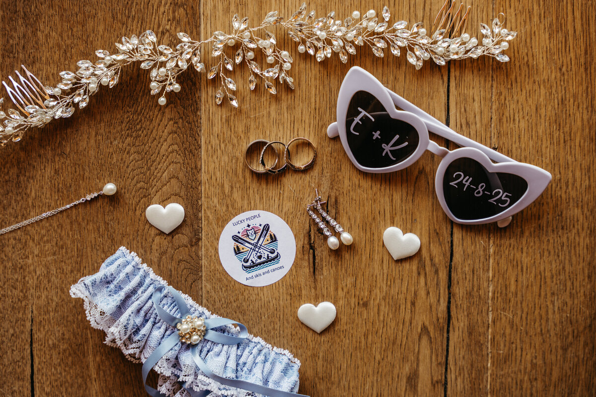 Bridal accessories and jewelry flat lay with mountain light