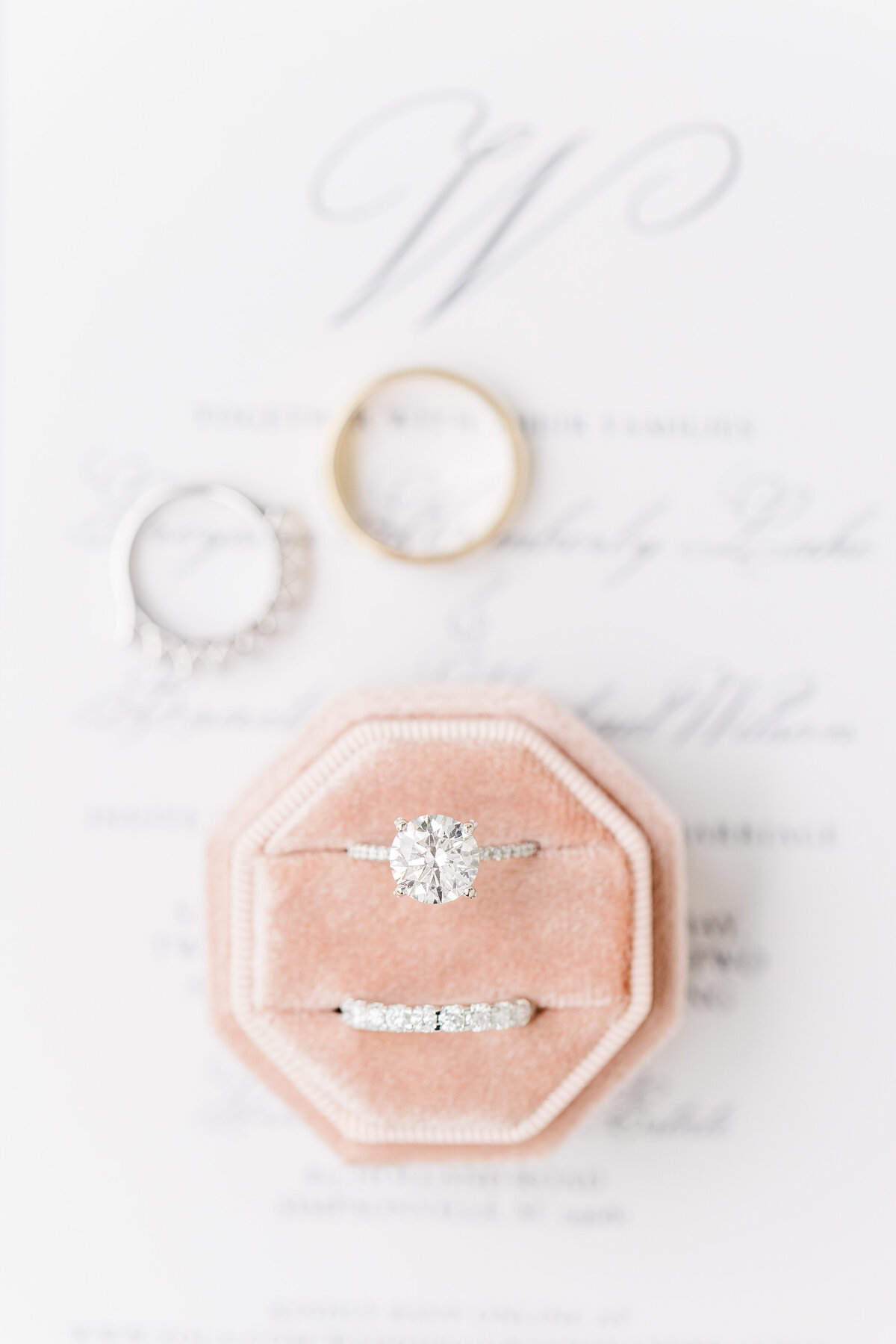wedding rings in a pink ring box