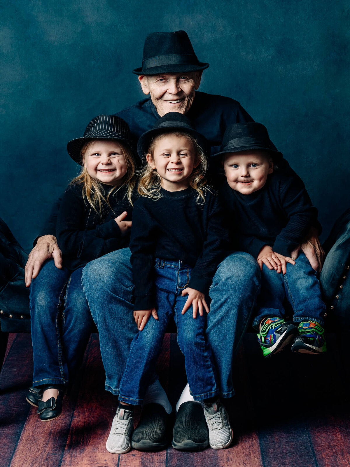 Grandfather poses with smiling kids in Prescott family photos