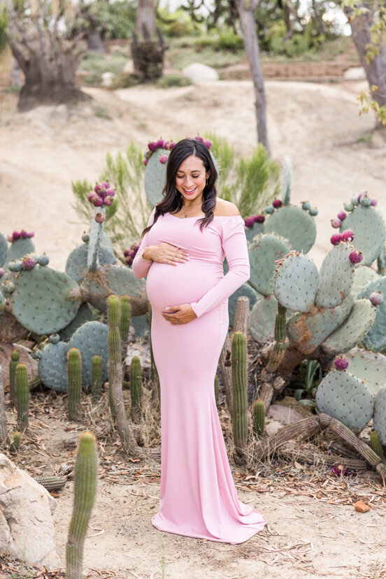 pregnant woman standing in cactus garden San Diego