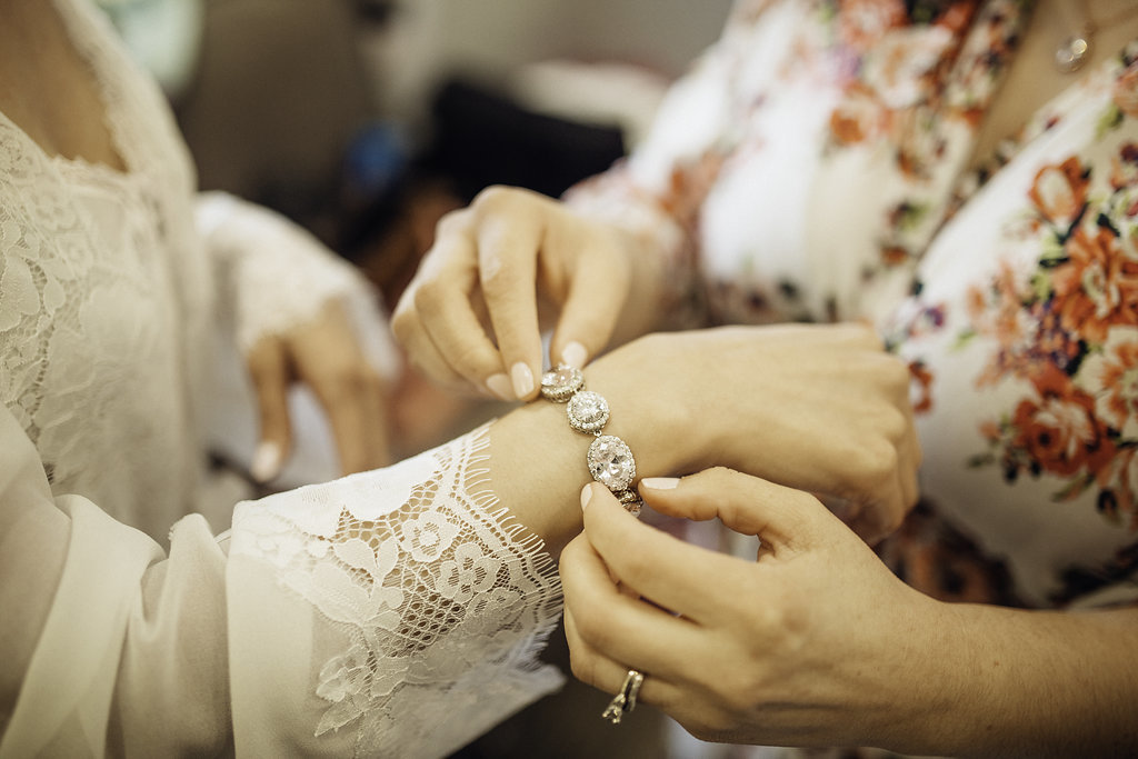 Wedding Photograph Of Woman Fixing Bracelet Los Angeles