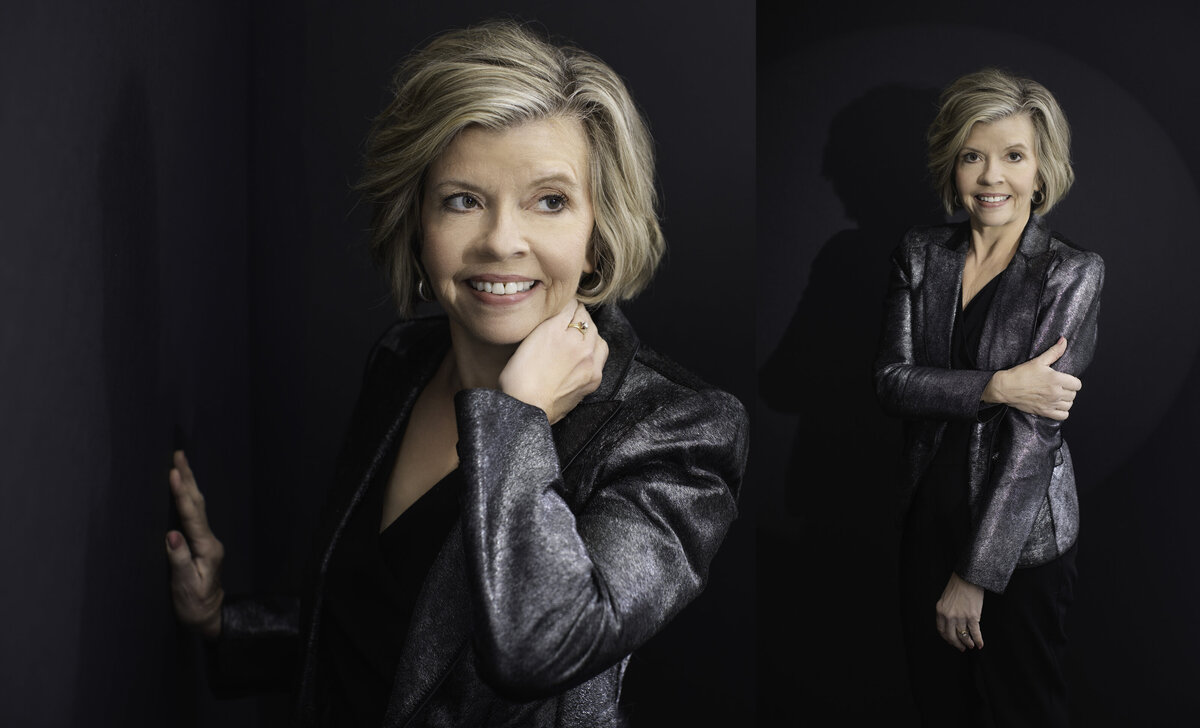 Captivating portraits taken in Cincinnati's downtown studio feature a mature woman in her late 60's exuding elegance and charm. The shimmer of her silver jacket contrasts with the deep, dark backdrop, drawing focus to her confident smile and playful, windswept hairstyle