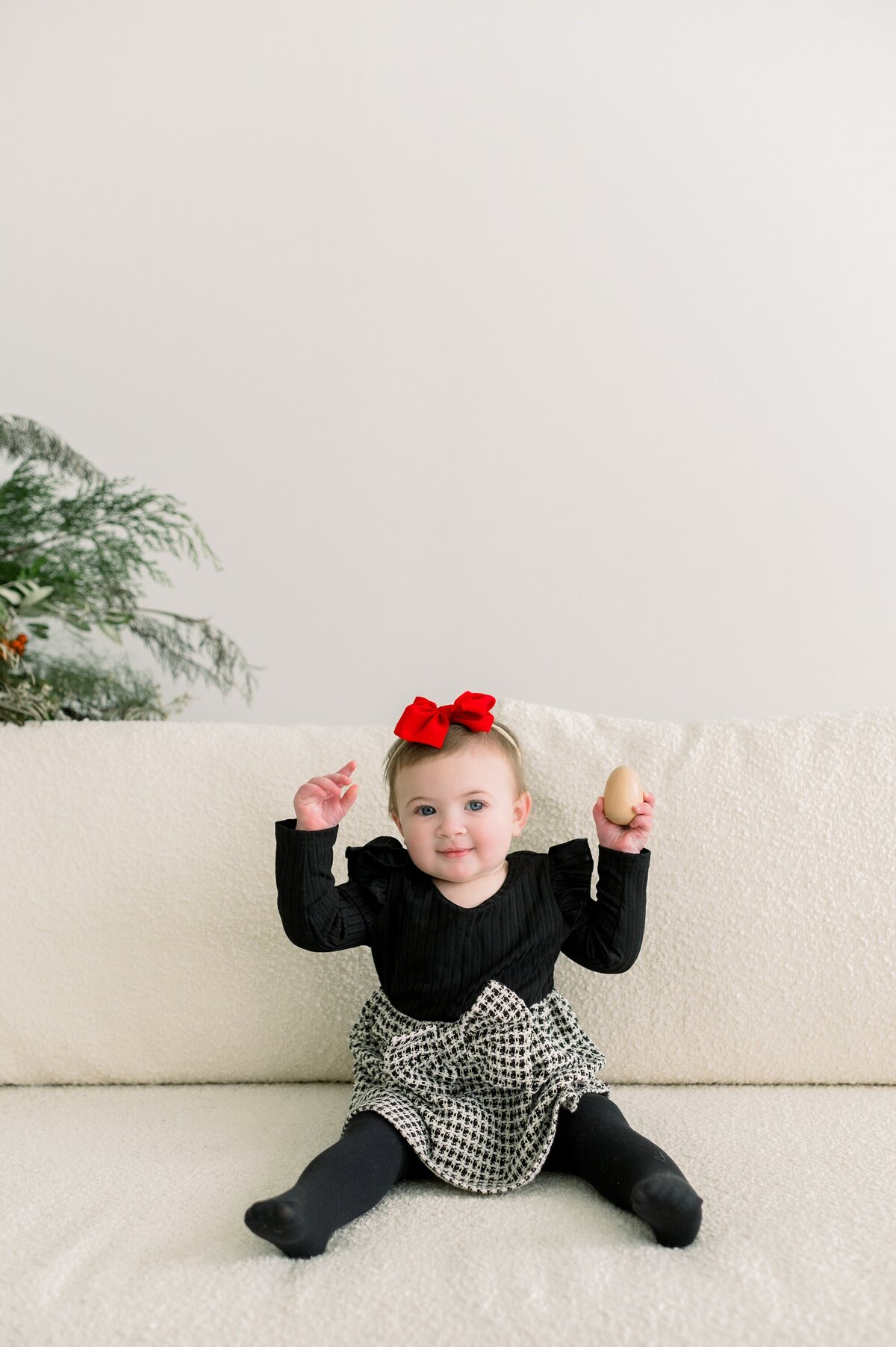 baby in black and white Christmas outfit