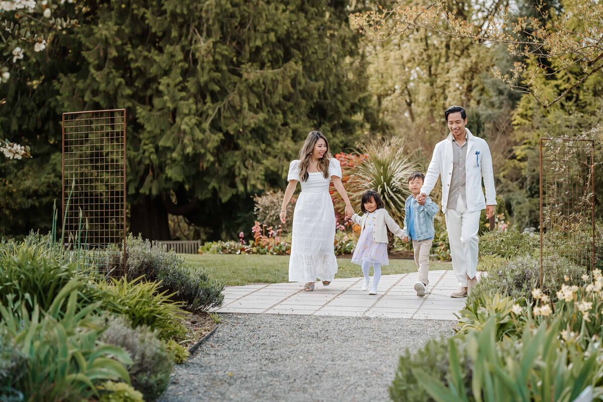 Family strolling through the Bellevue Botanical Garden in spring, enjoying the blooming flowers and fresh air.