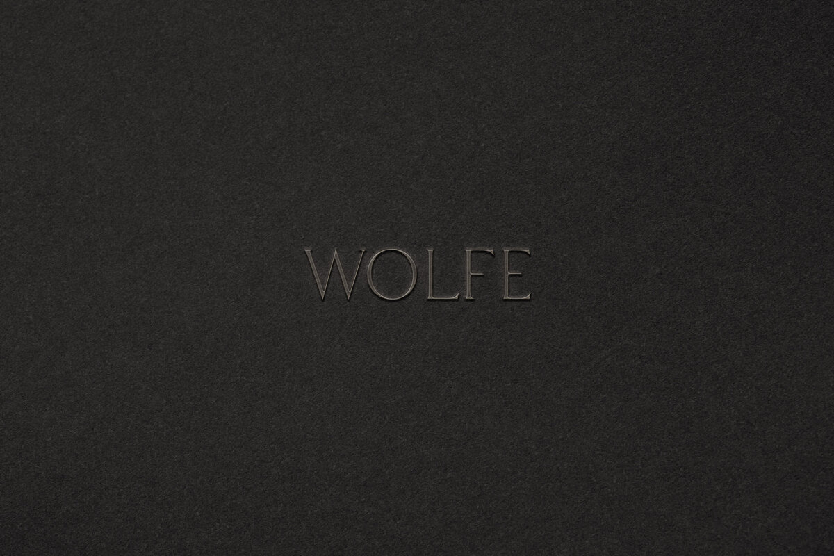 Edgy brand identity for a fashion boutique, combining dark tones and modern design details.