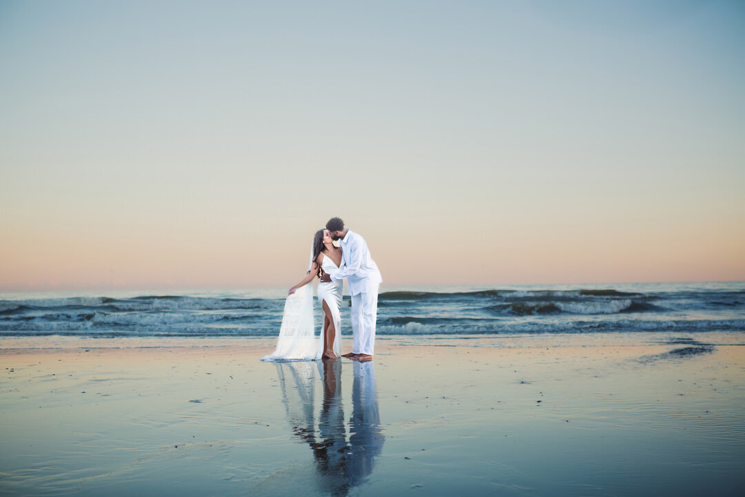Folly beach wedding Charleston Wedding Photographer bride and groom in the water