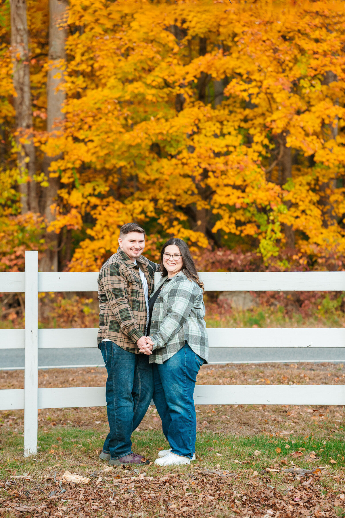 Candid New England fall engagement photography with emotional natural moments.