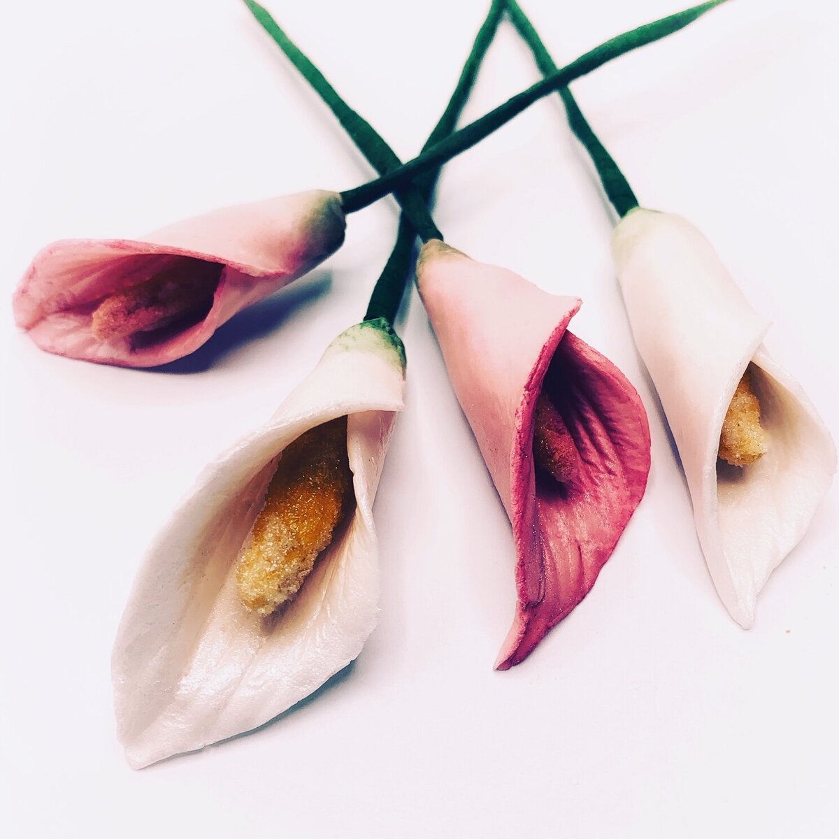 Calla lily sugar flowers in pink and ivory