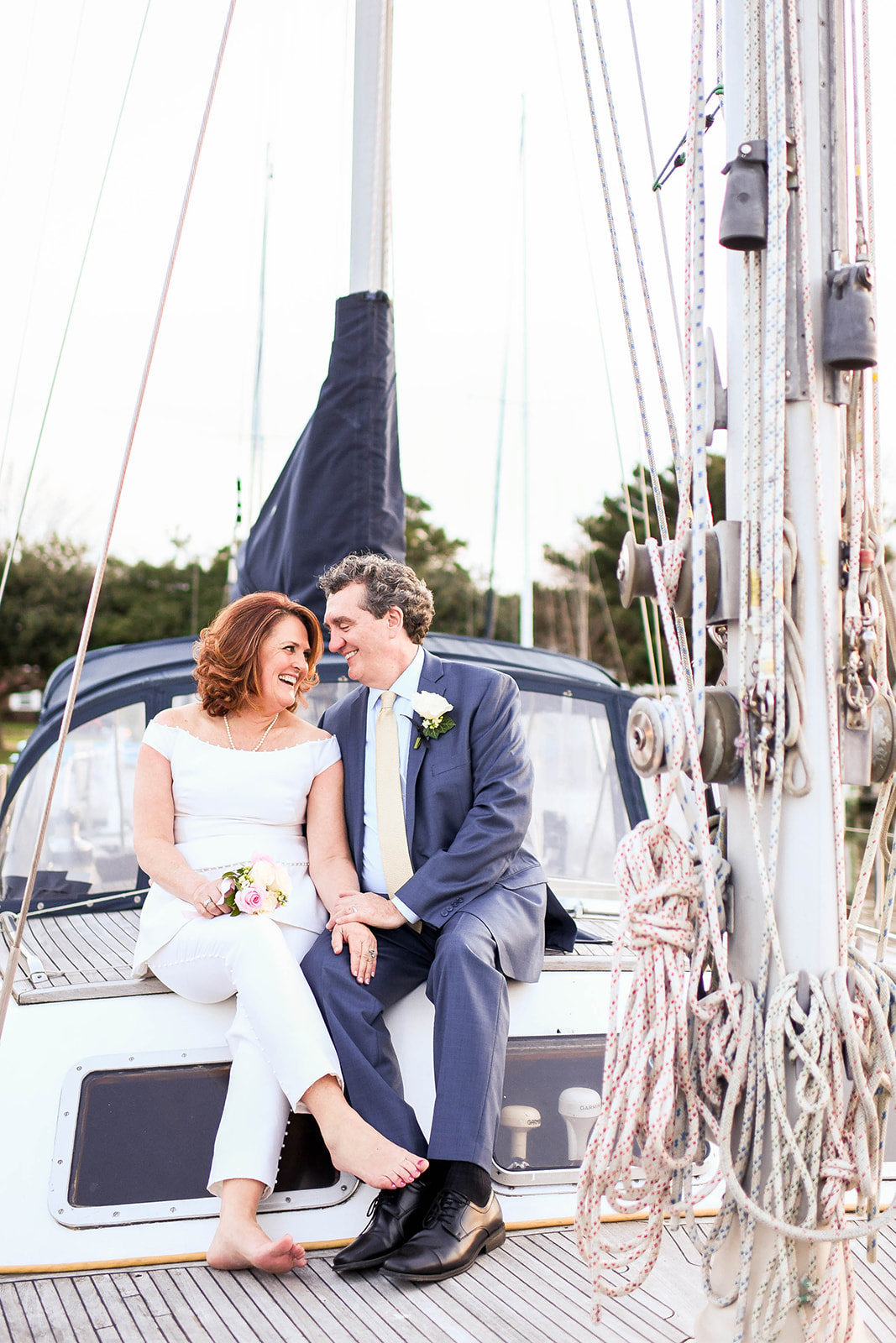 Bride and groom on sailboat